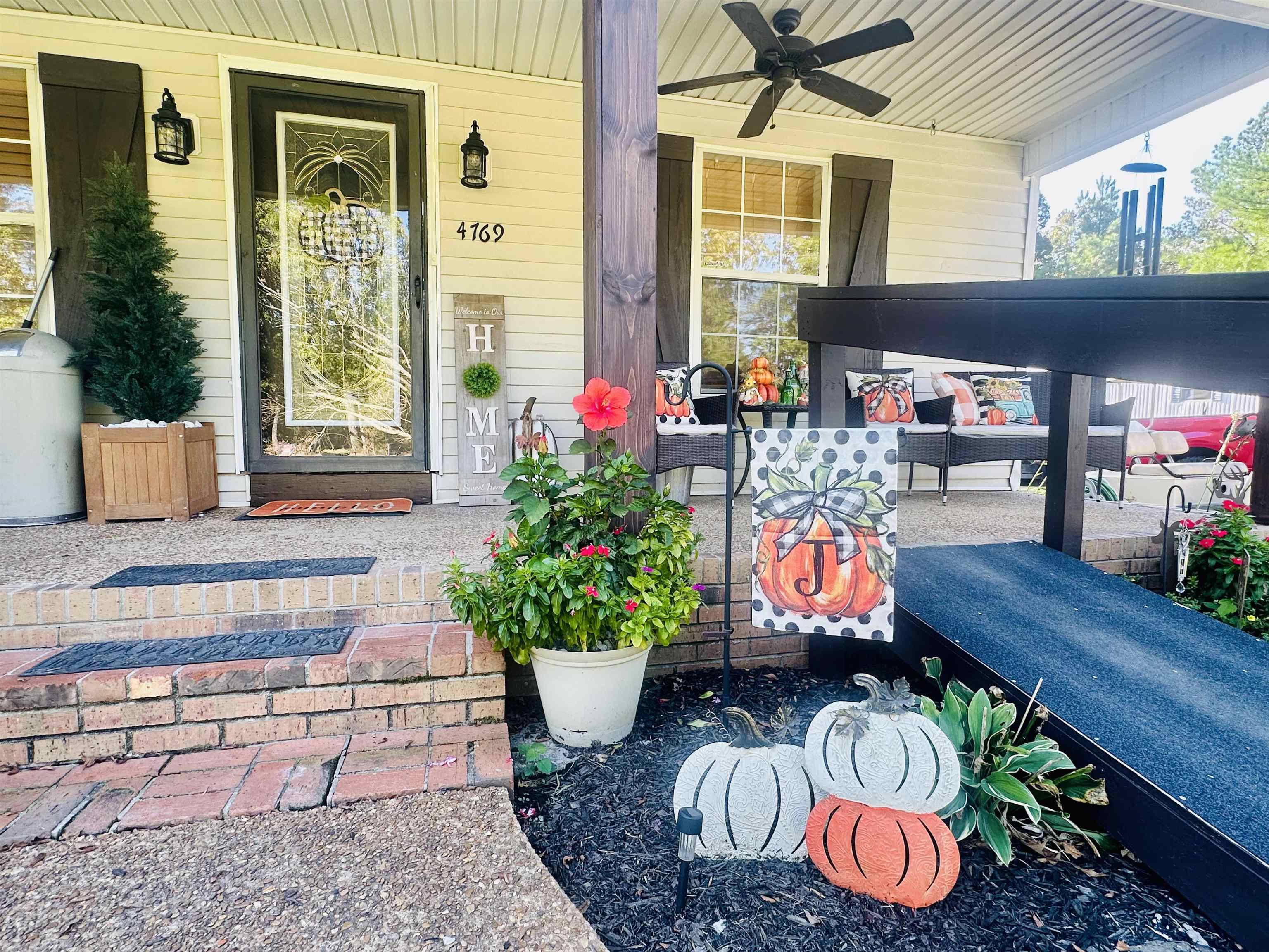 4769 Pleasant Site Road Selmer, TN 38375 - Photo 2 of 28 a outdoor dining space with furniture and potted plants