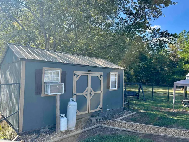 a house view with a backyard space