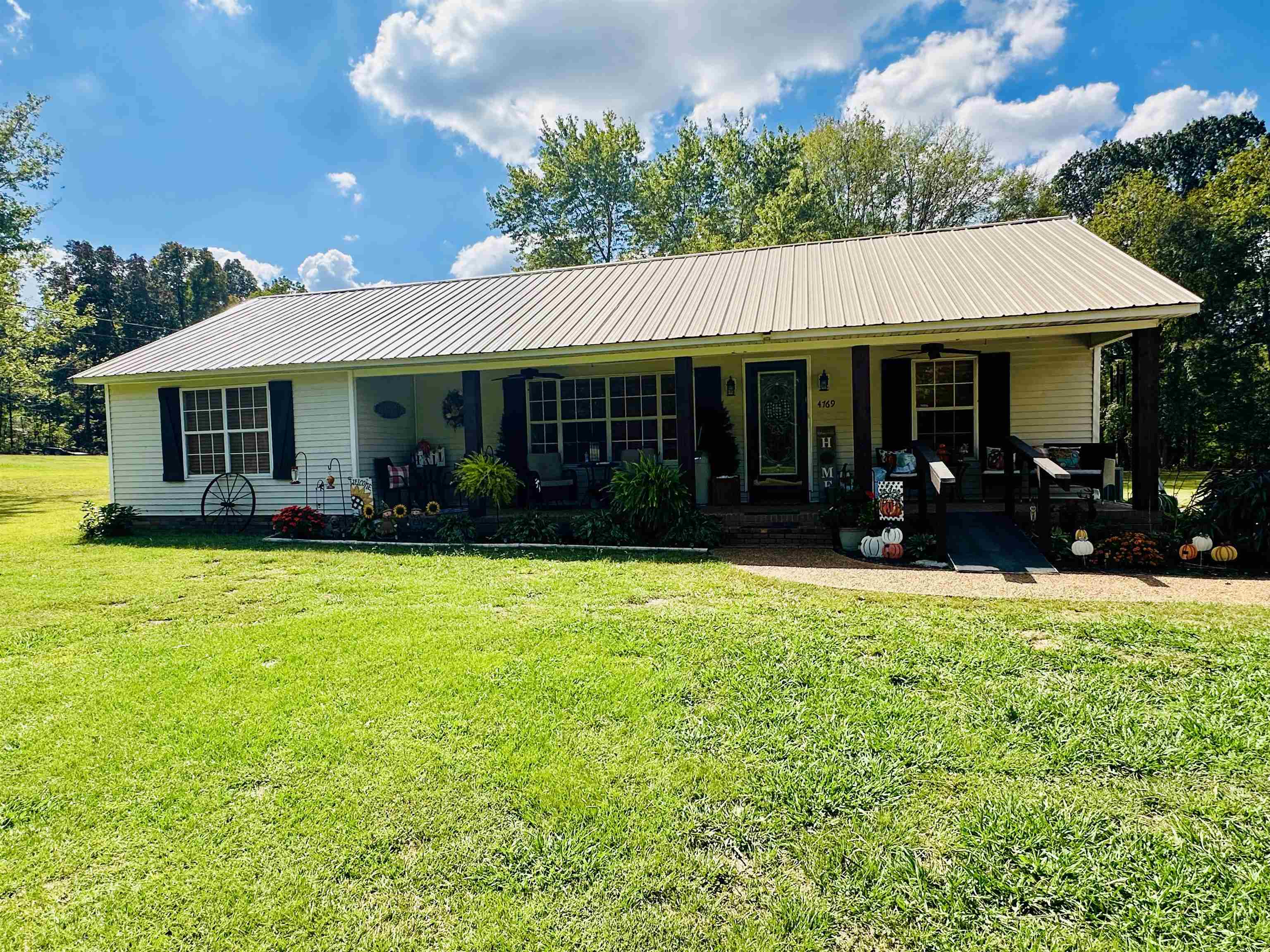 4769 Pleasant Site Road Selmer, TN 38375 - Photo 28 of 28 a front view of a house with garden