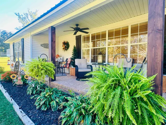 a front view of a house with garden