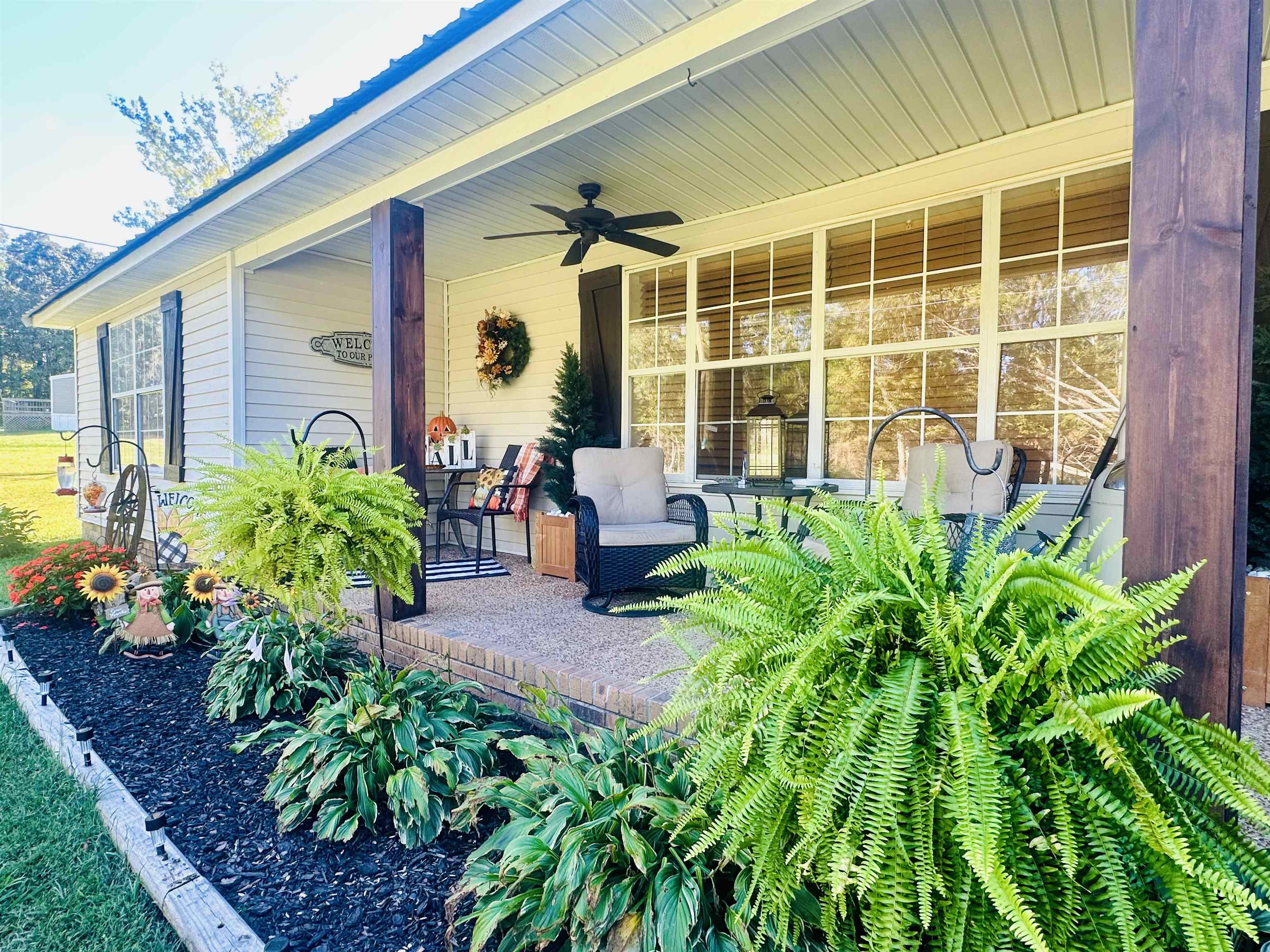 4769 Pleasant Site Road Selmer, TN 38375 - Photo 3 of 28 a front view of a house with garden