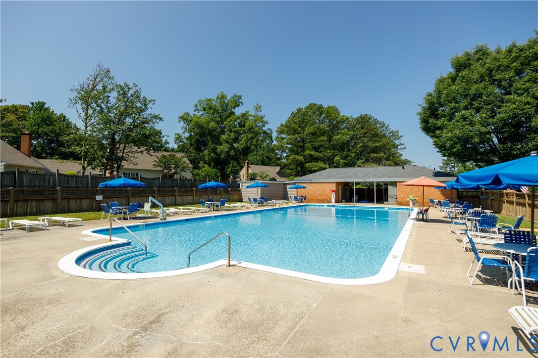 9129 Derbyshire Road, Unit E Henrico, VA 23229 - Photo 35 of 36 Expansive outdoor swimming pool with integrated st