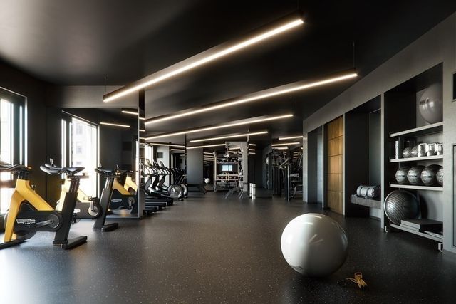 a living room with patio furniture and a floor to ceiling window