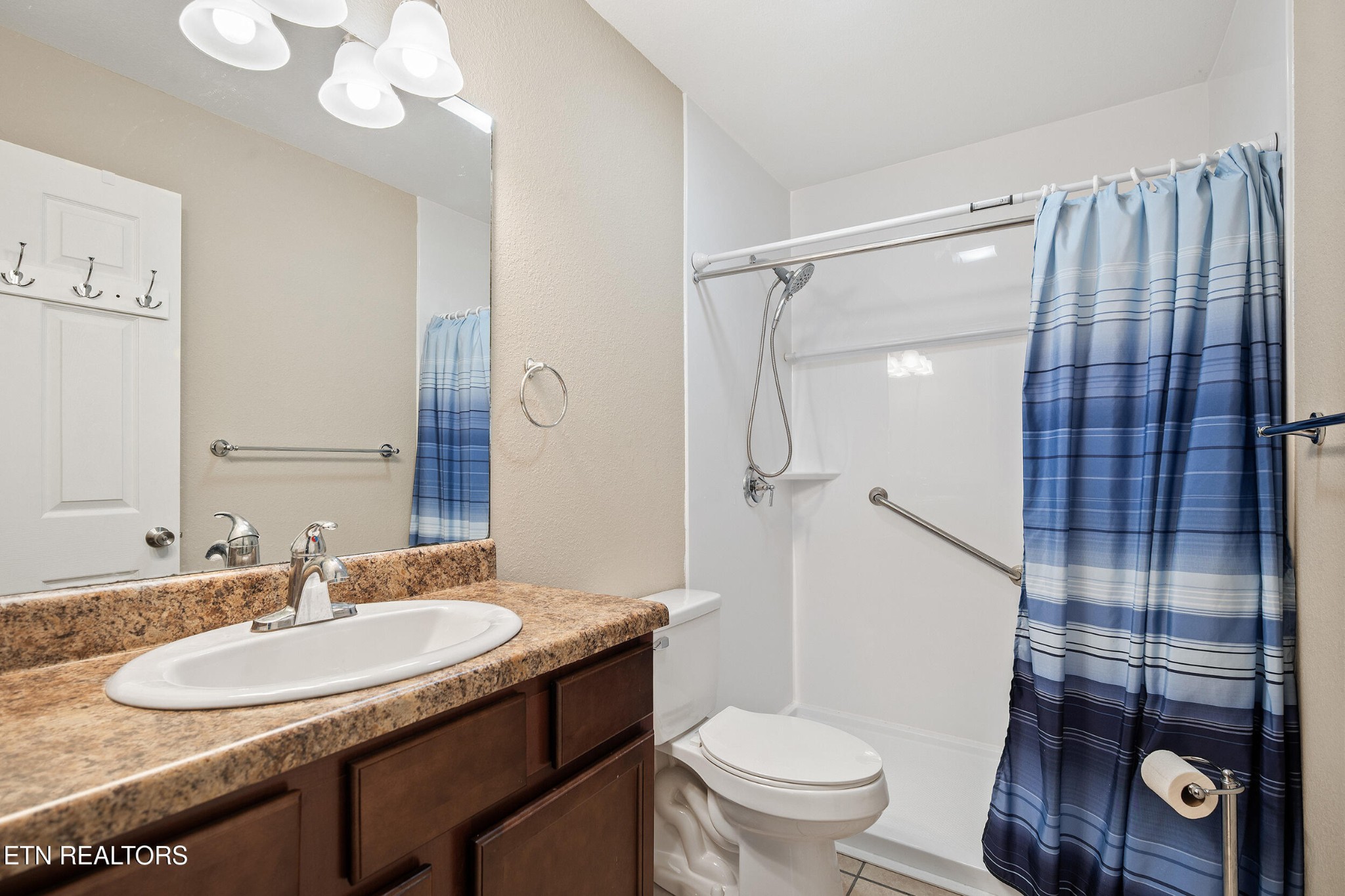 534 Shellbark Road Newport, TN 37821 - Photo 12 of 29 a bathroom with a sink toilet vanity and shower