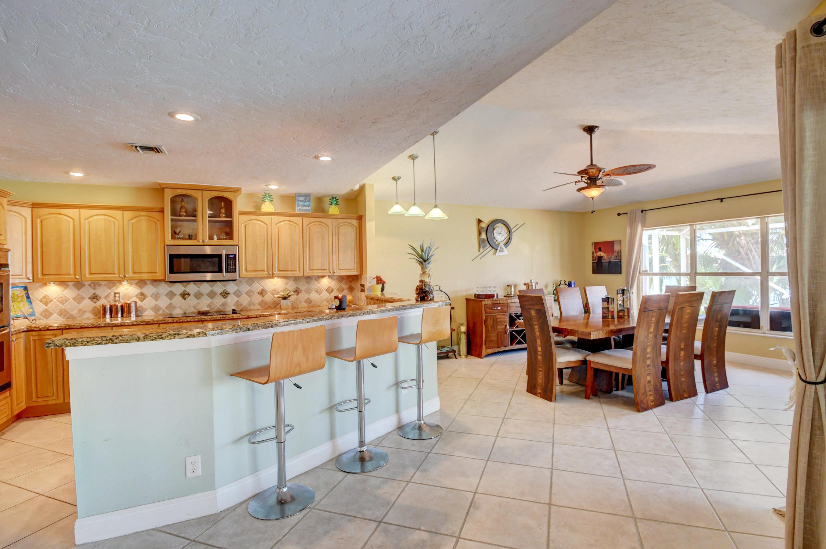12491 Baywind Court Boca Raton, FL 33428 - Photo 37 of 63 Kitchen and Dining Area