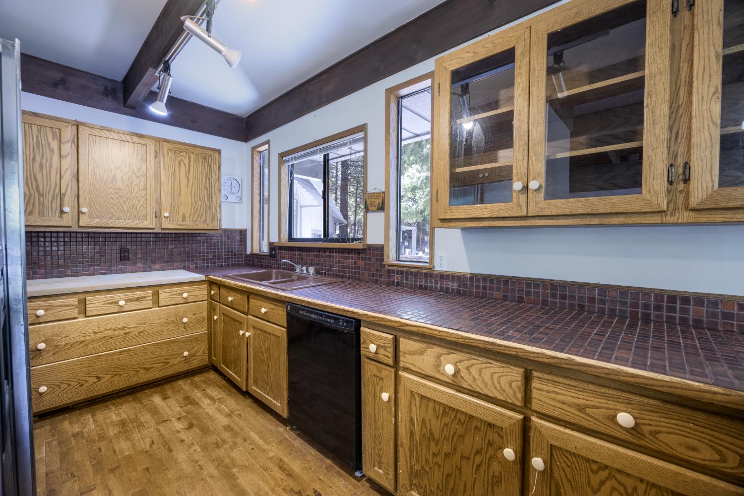 2070 King Of The Mountain Road Pollock Pines, CA 95726 - Photo 11 of 53 a kitchen with stainless steel appliances granite countertop sink stove and cabinets