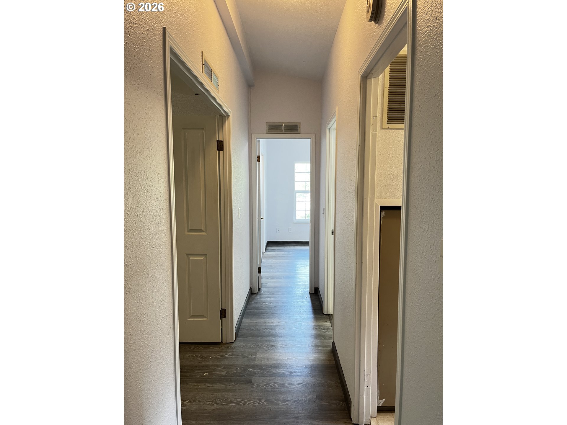 83411 Clear Lake Road Florence, OR 97439 - Photo 24 of 47 a view of a hallway with wooden floor