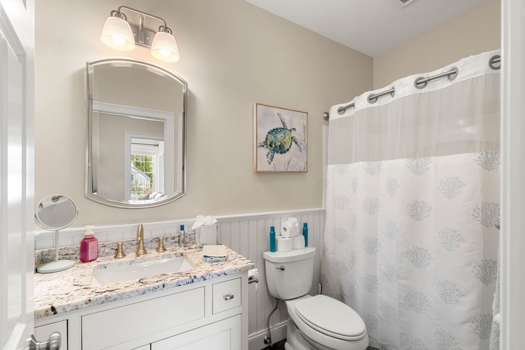 4 Point Shore Overlook Amesbury, MA 01913 - Photo 26 of 42 a bathroom with a granite countertop sink mirror vanity and toilet