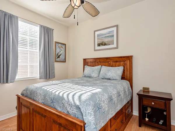 a bedroom with a bed and a tv