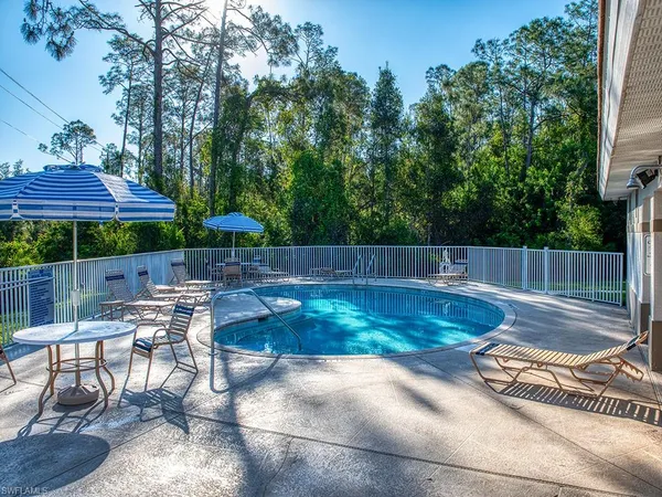 a view of a backyard with sitting area