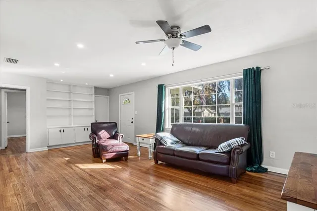 a living room with furniture and window