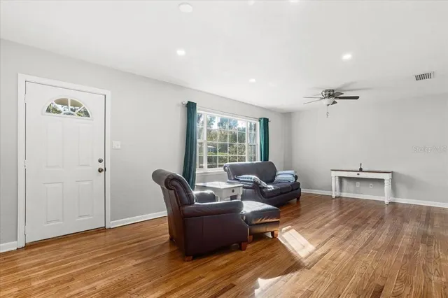 a living room with furniture and a window