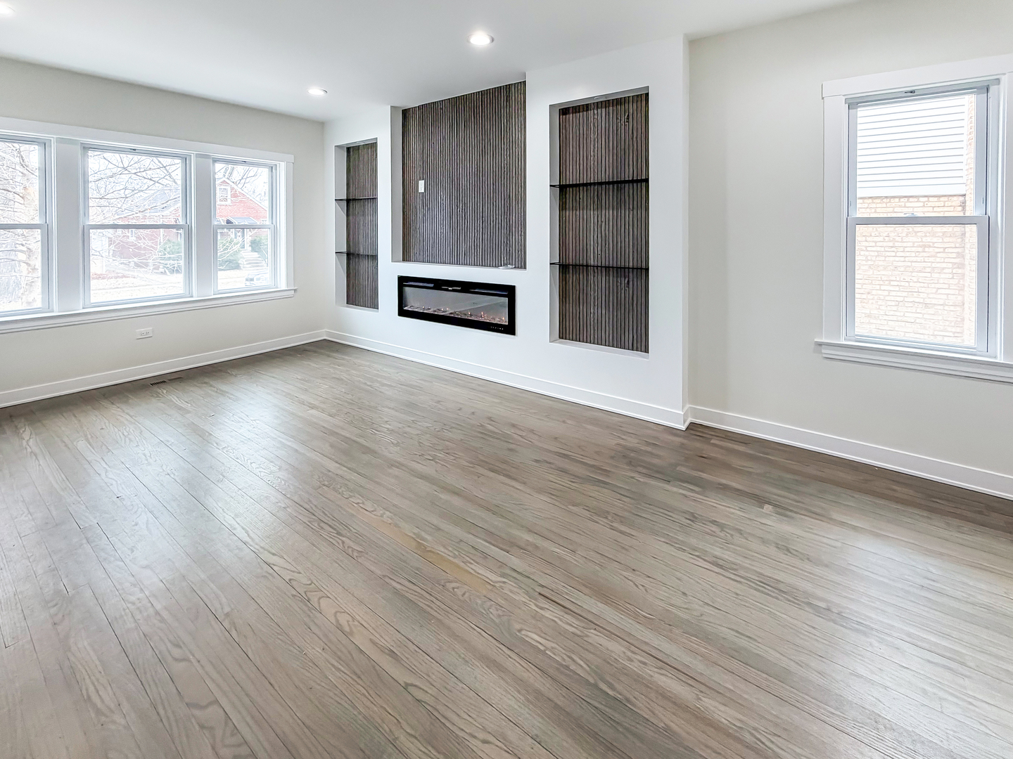 3128 Arthur Avenue Brookfield, IL 60513 - Photo 4 of 35 an empty room with wooden floor and windows