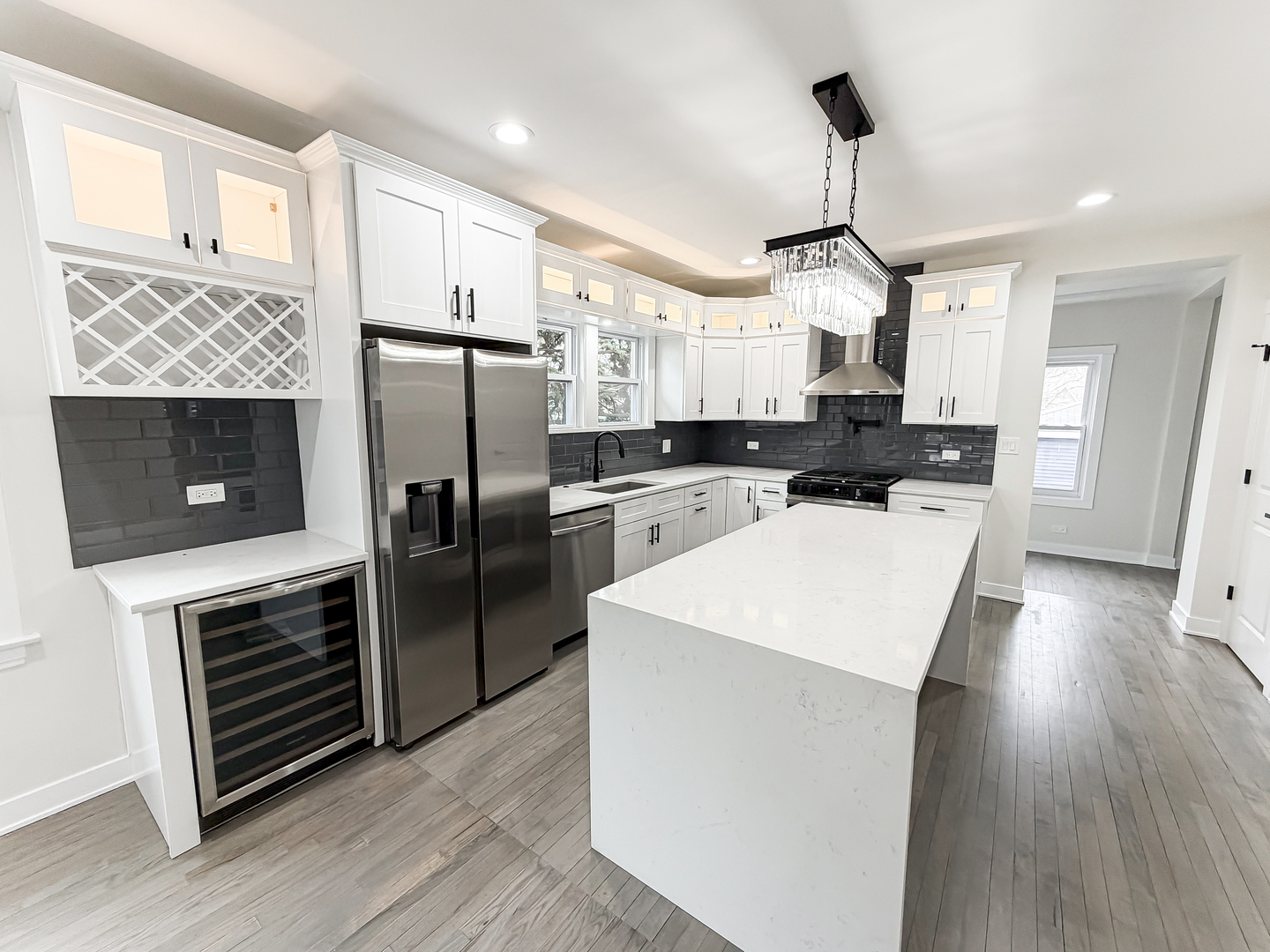 3128 Arthur Avenue Brookfield, IL 60513 - Photo 9 of 35 a kitchen with a refrigerator a sink and wooden floor