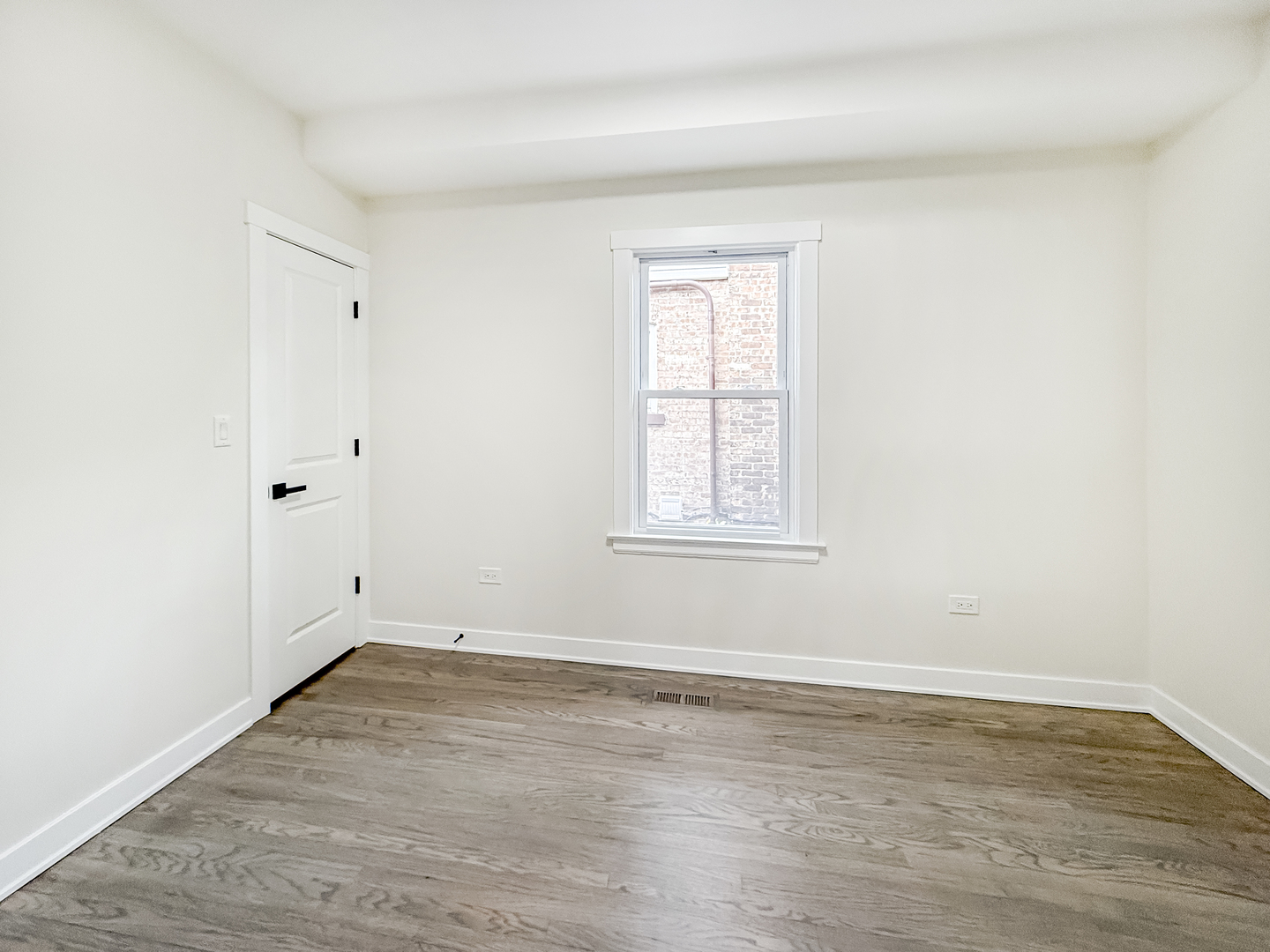 3128 Arthur Avenue Brookfield, IL 60513 - Photo 10 of 35 an empty room with wooden floor and windows