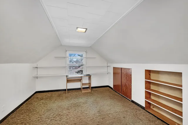 a view of room with cabinets and bed
