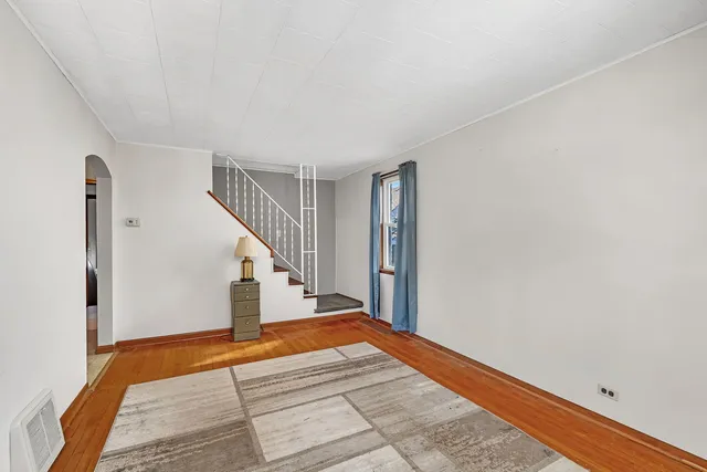 a view of an empty room with stairs