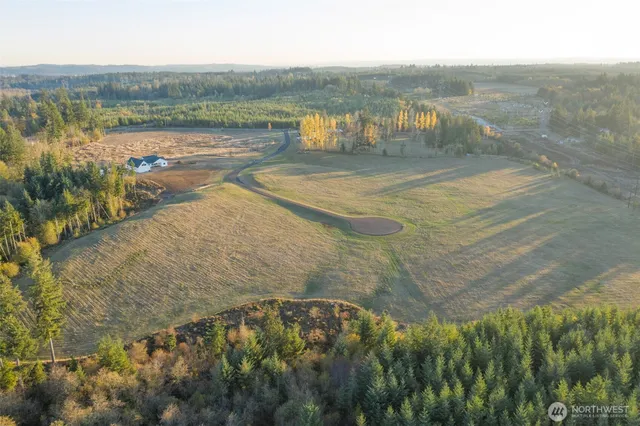 a view of lake with green space