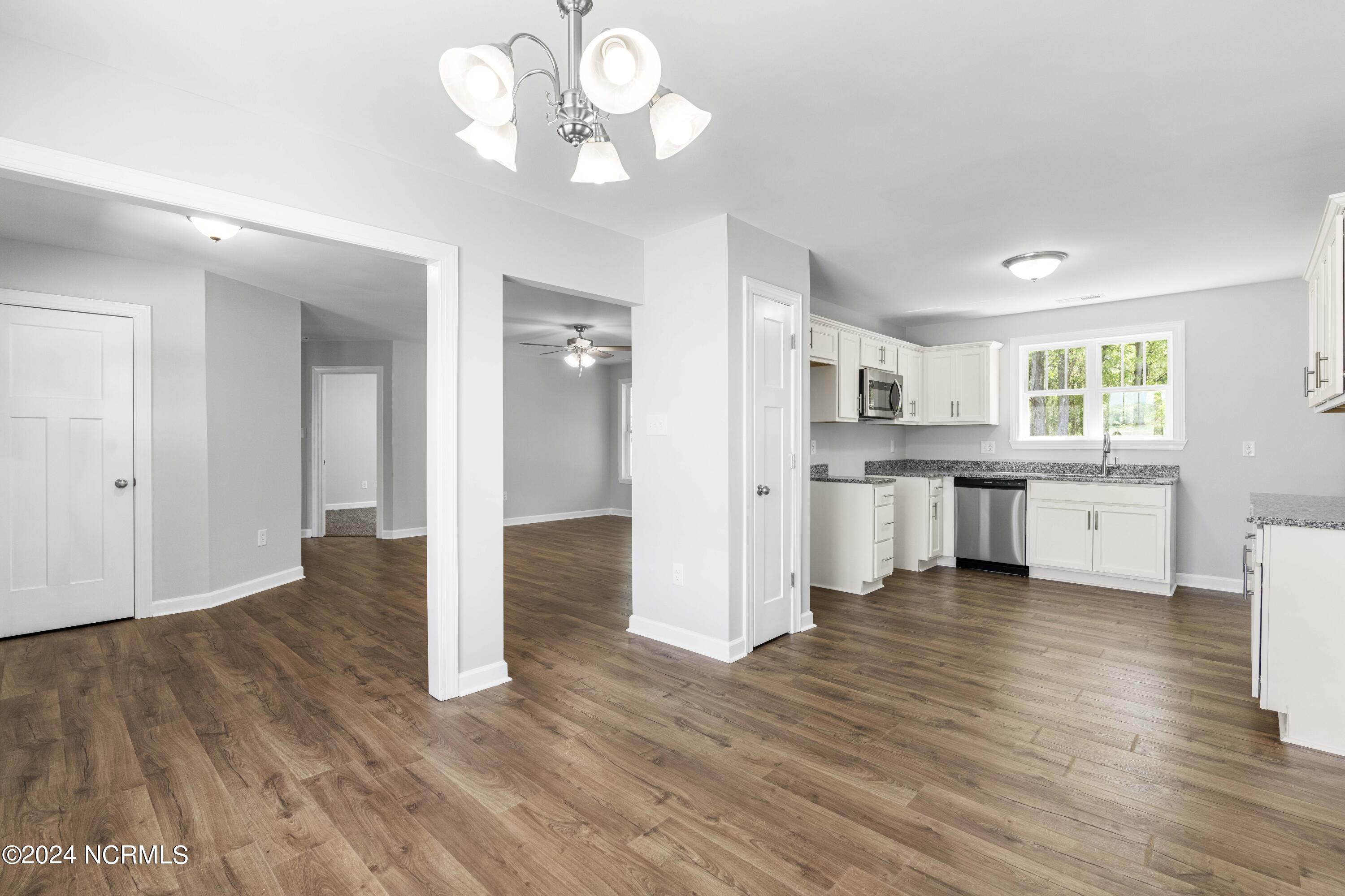 291 Wiggs Road Selma, NC 27576 - Photo 7 of 20 From Dining to Kitchen & Living Room