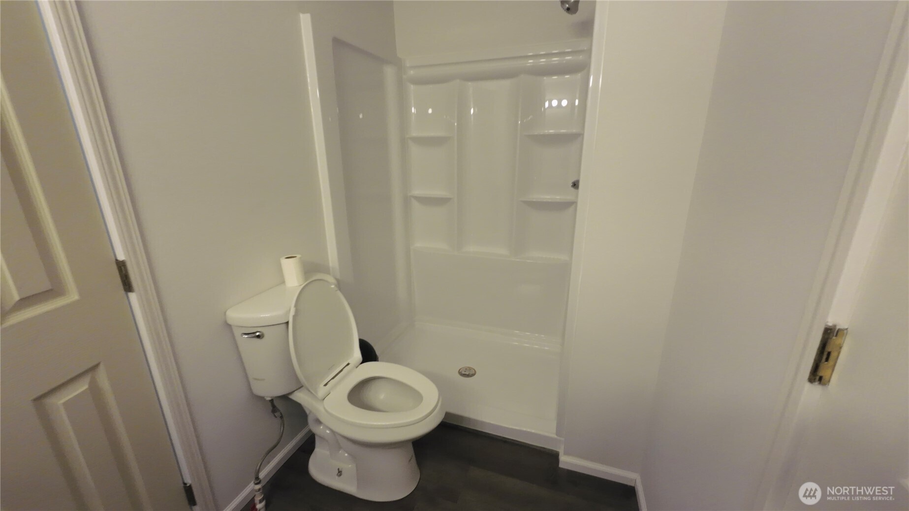 6800 Enterprise, Unit 9 Ferndale, WA 98248 - Photo 13 of 22 a white toilet sitting next to a bathroom sink and vanity