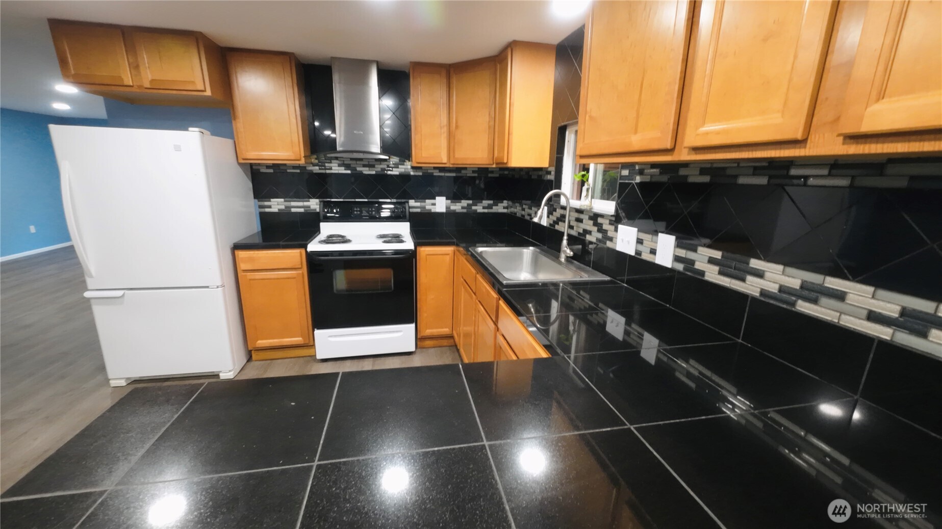 6800 Enterprise, Unit 9 Ferndale, WA 98248 - Photo 6 of 22 a kitchen with stainless steel appliances a stove a refrigerator and a microwave