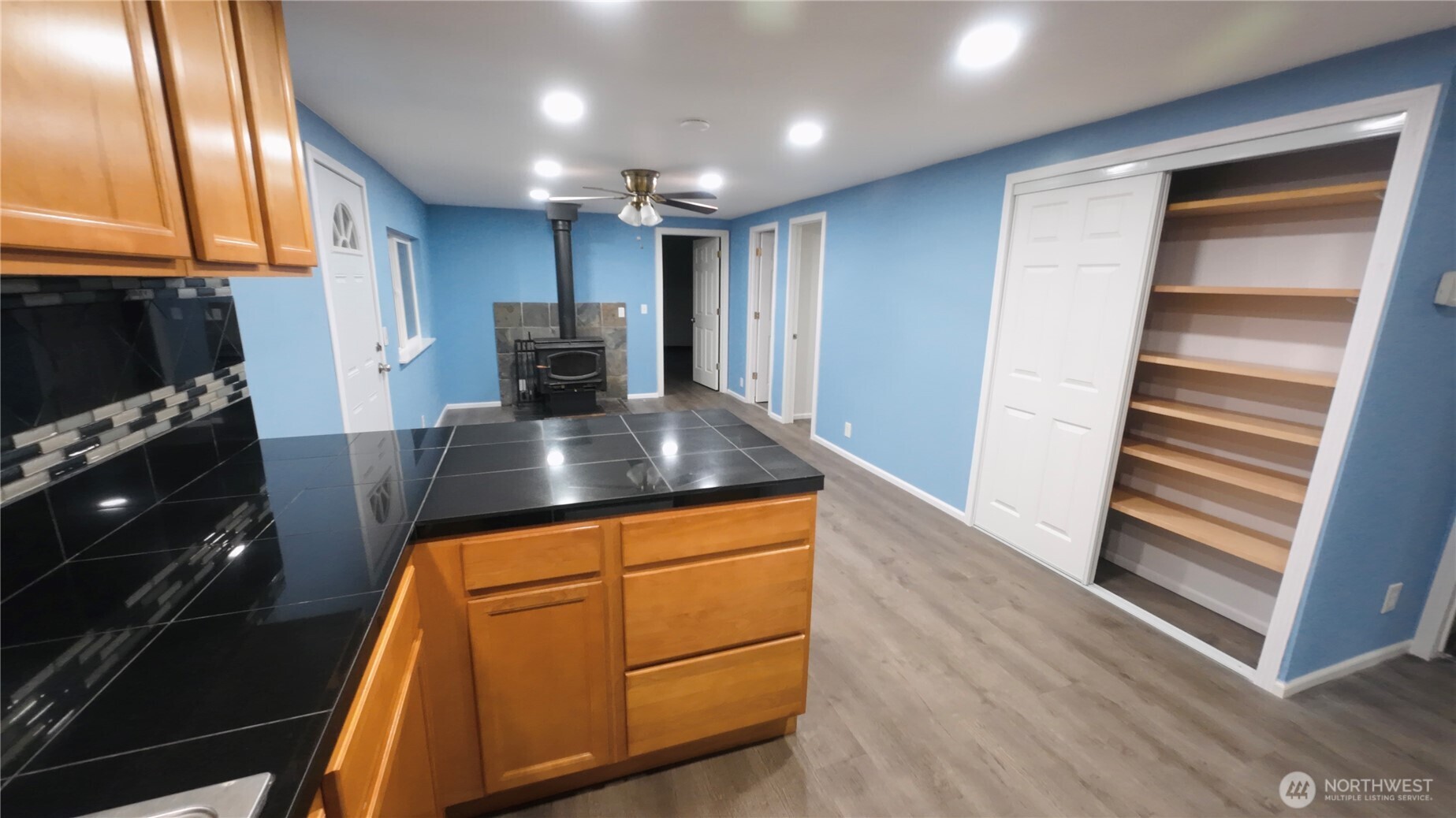 6800 Enterprise, Unit 9 Ferndale, WA 98248 - Photo 8 of 22 a kitchen with kitchen island granite countertop wooden cabinets and a stainless steel appliances