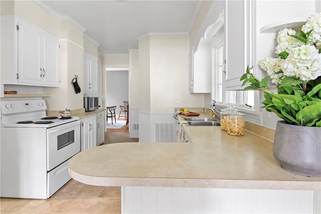 400 North Porter Street Dix, NY 14891 - Photo 19 of 35 Bright Kitchen Featuring Ample Cabinetry and Direc