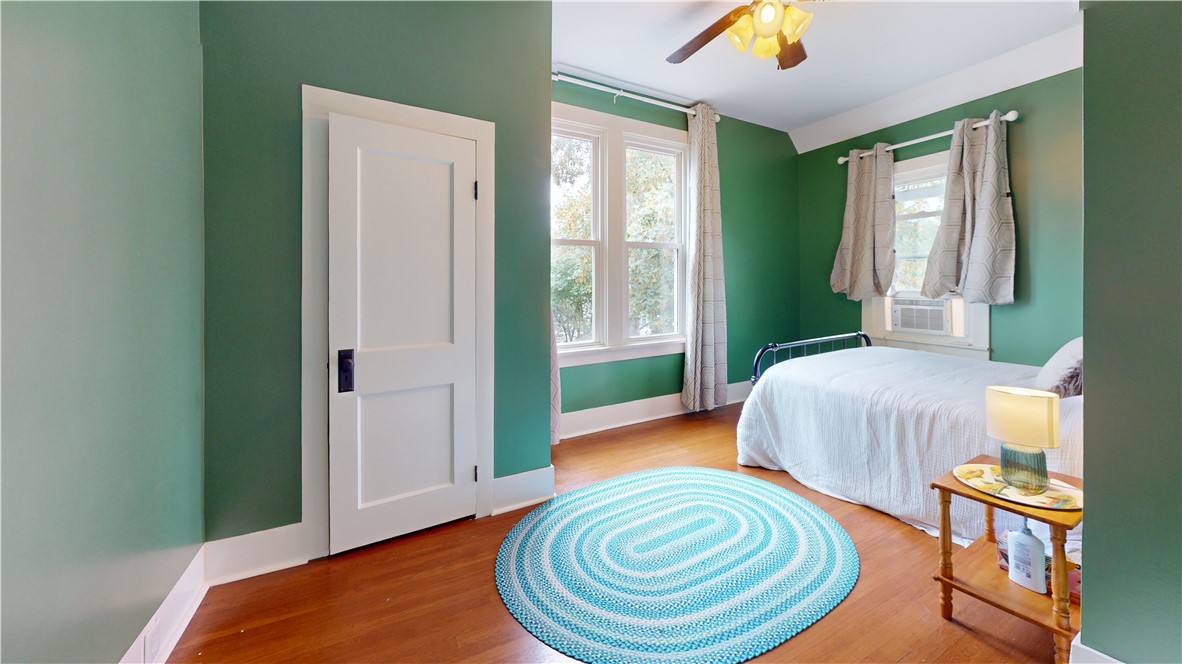 400 North Porter Street Dix, NY 14891 - Photo 33 of 35 Charming bedroom with rich wood floors, fresh gree