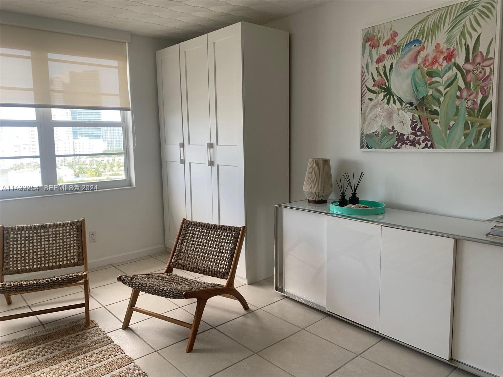 100 Lincoln Road, Unit 1039 Miami Beach, FL 33139 - Photo 13 of 26 a living room with furniture and a window