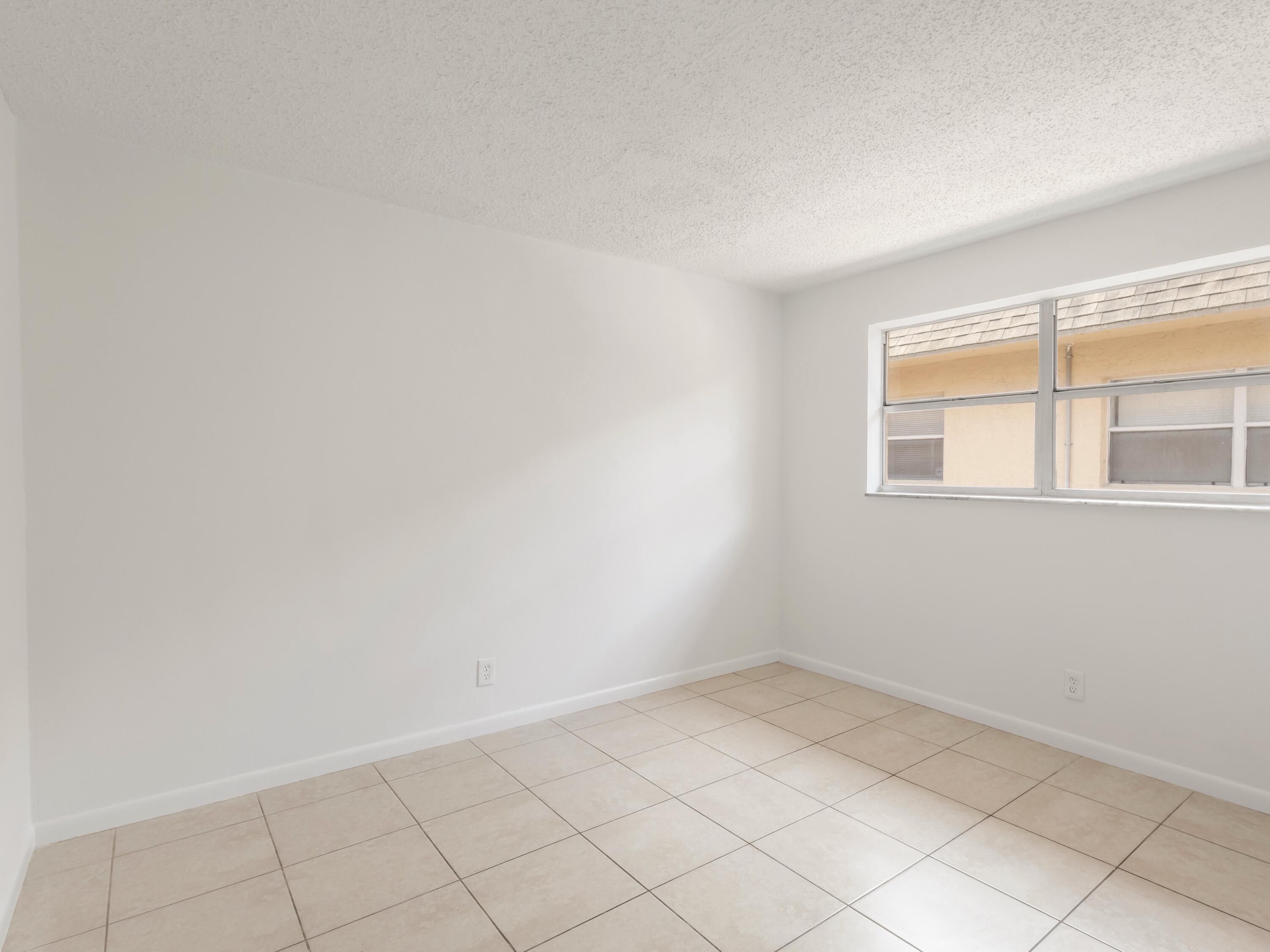 450 Southwest 2nd Avenue, Unit 2050 Boca Raton, FL 33432 - Photo 9 of 11 a view of an empty room with a window