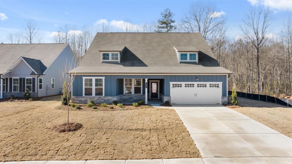 a view of house with yard