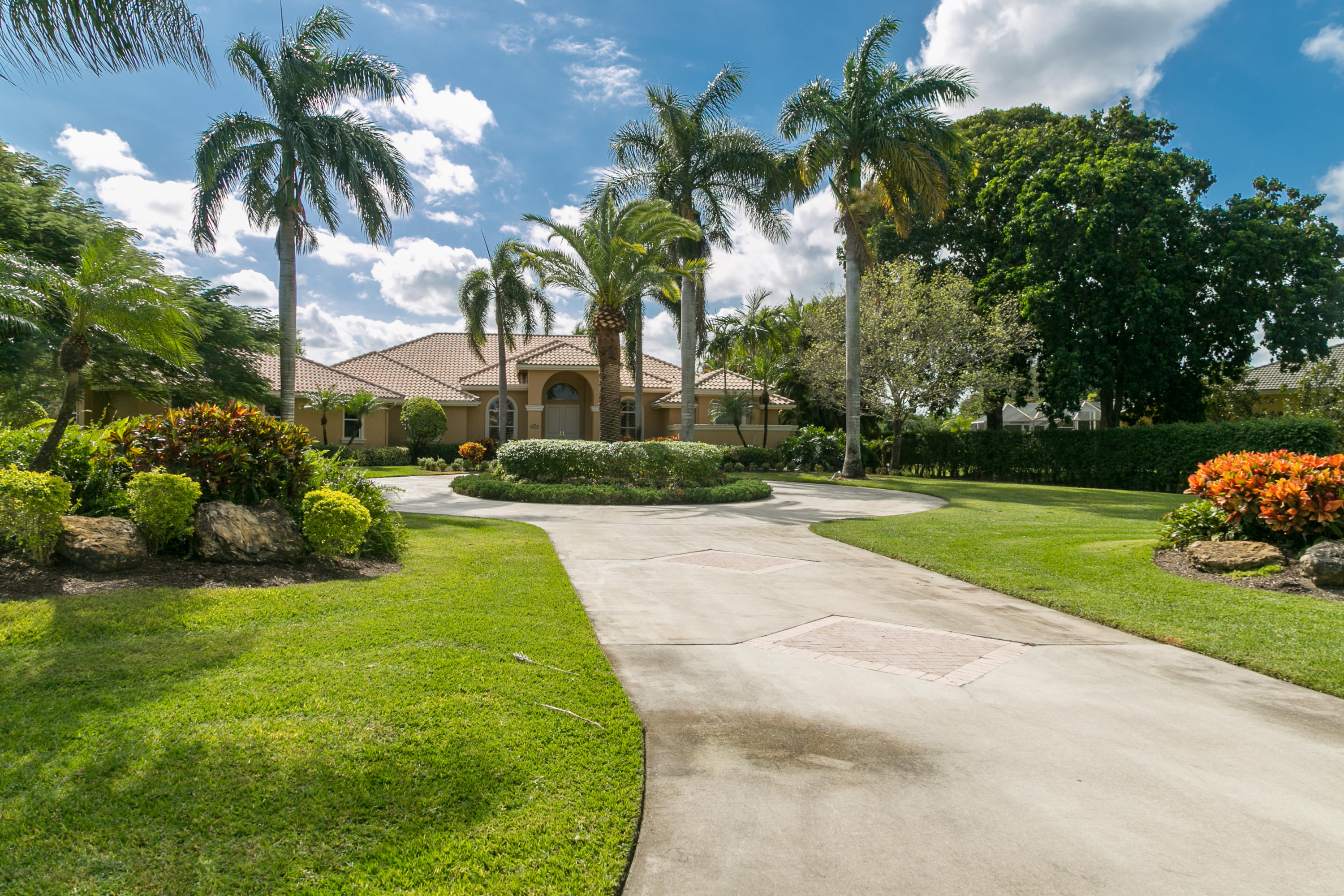 8666 Sawpine Road Delray Beach, FL 33446 - Photo 1 of 49 a view of a yard with palm trees