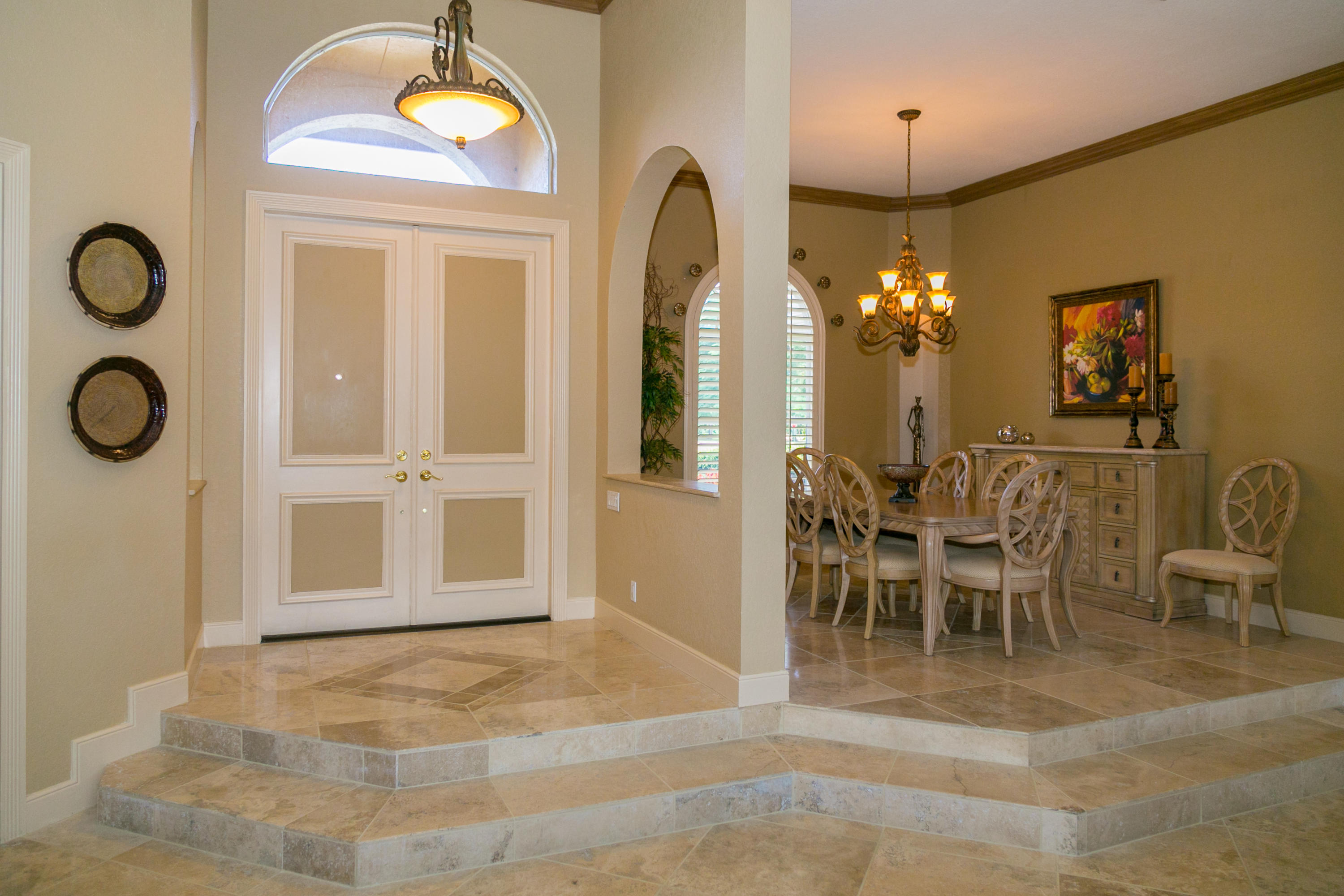 8666 Sawpine Road Delray Beach, FL 33446 - Photo 17 of 49 a view of a dining room with furniture and chandelier