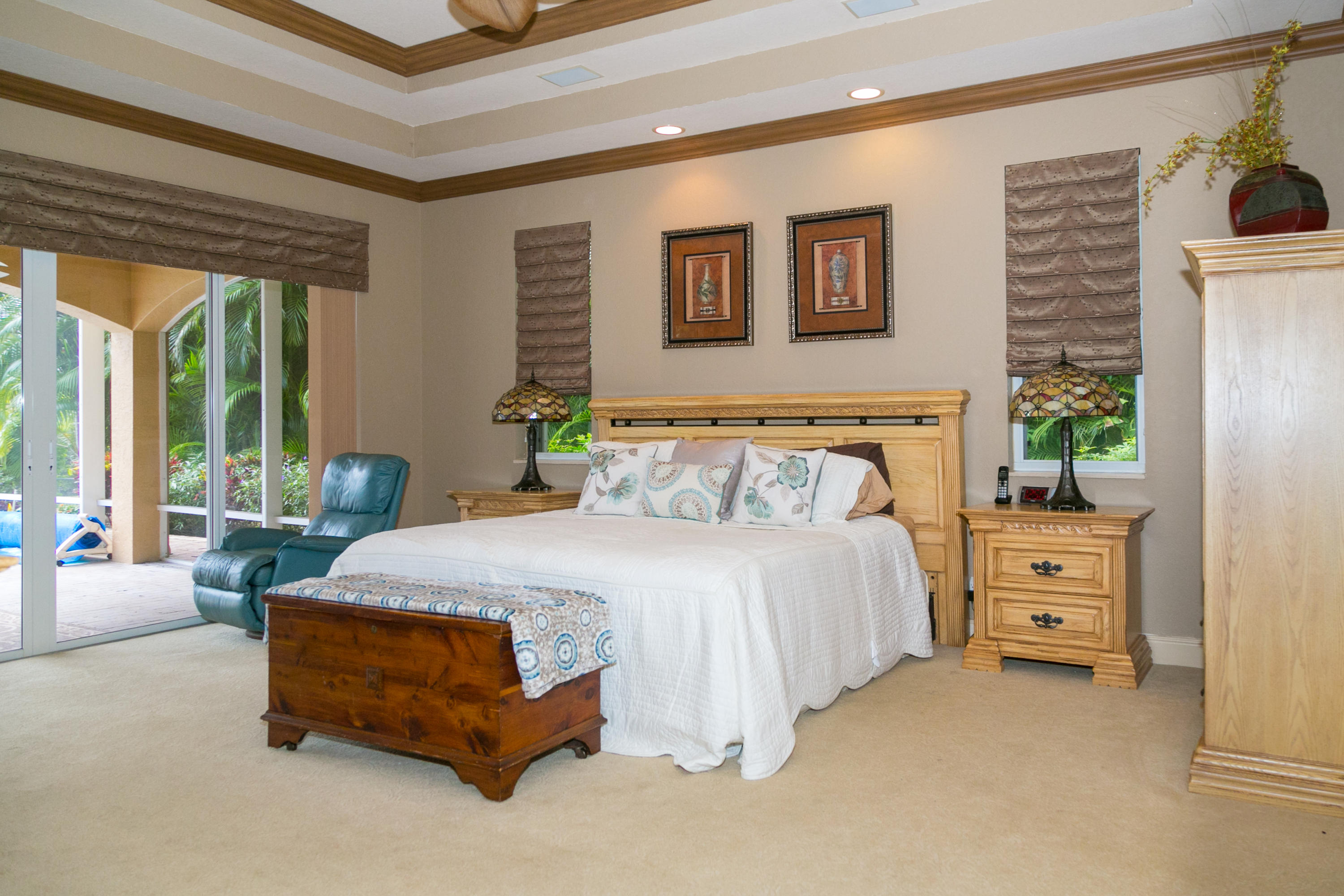 8666 Sawpine Road Delray Beach, FL 33446 - Photo 18 of 49 a spacious bedroom with a bed and window