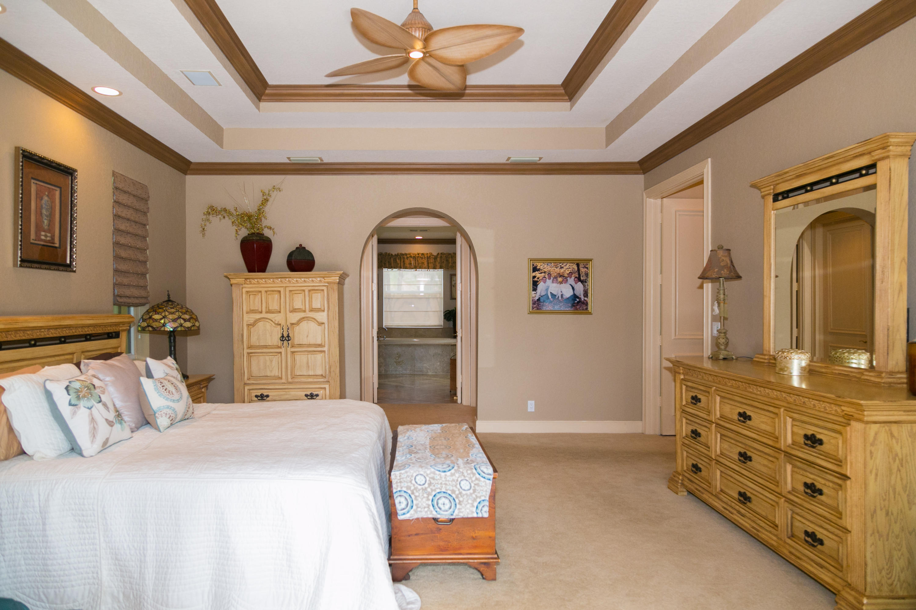8666 Sawpine Road Delray Beach, FL 33446 - Photo 21 of 49 a bedroom with a bed and a dresser