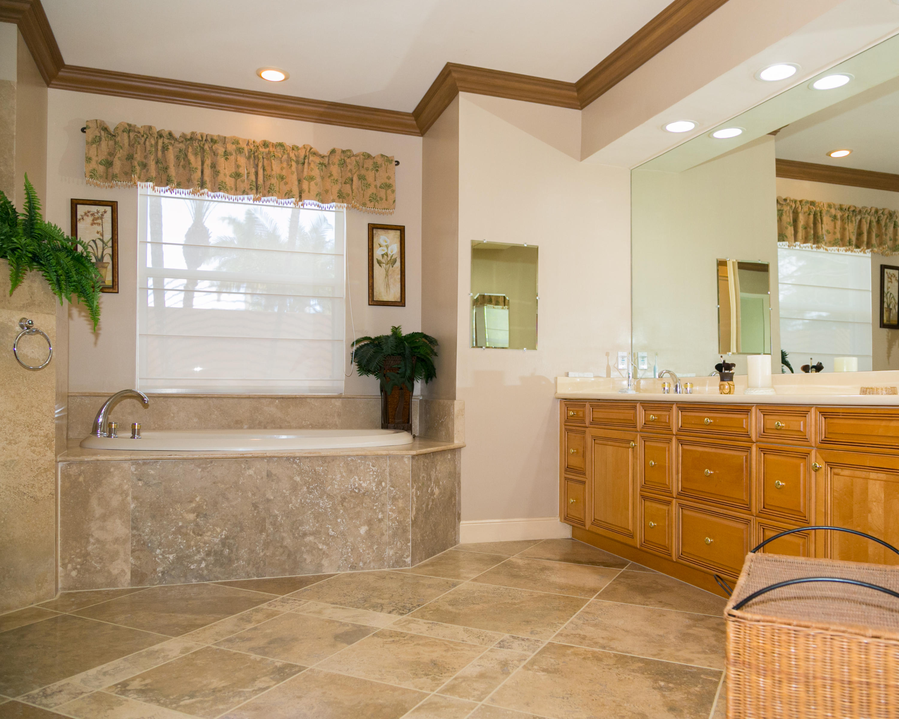 8666 Sawpine Road Delray Beach, FL 33446 - Photo 23 of 49 a bathroom with a tub sink and mirror