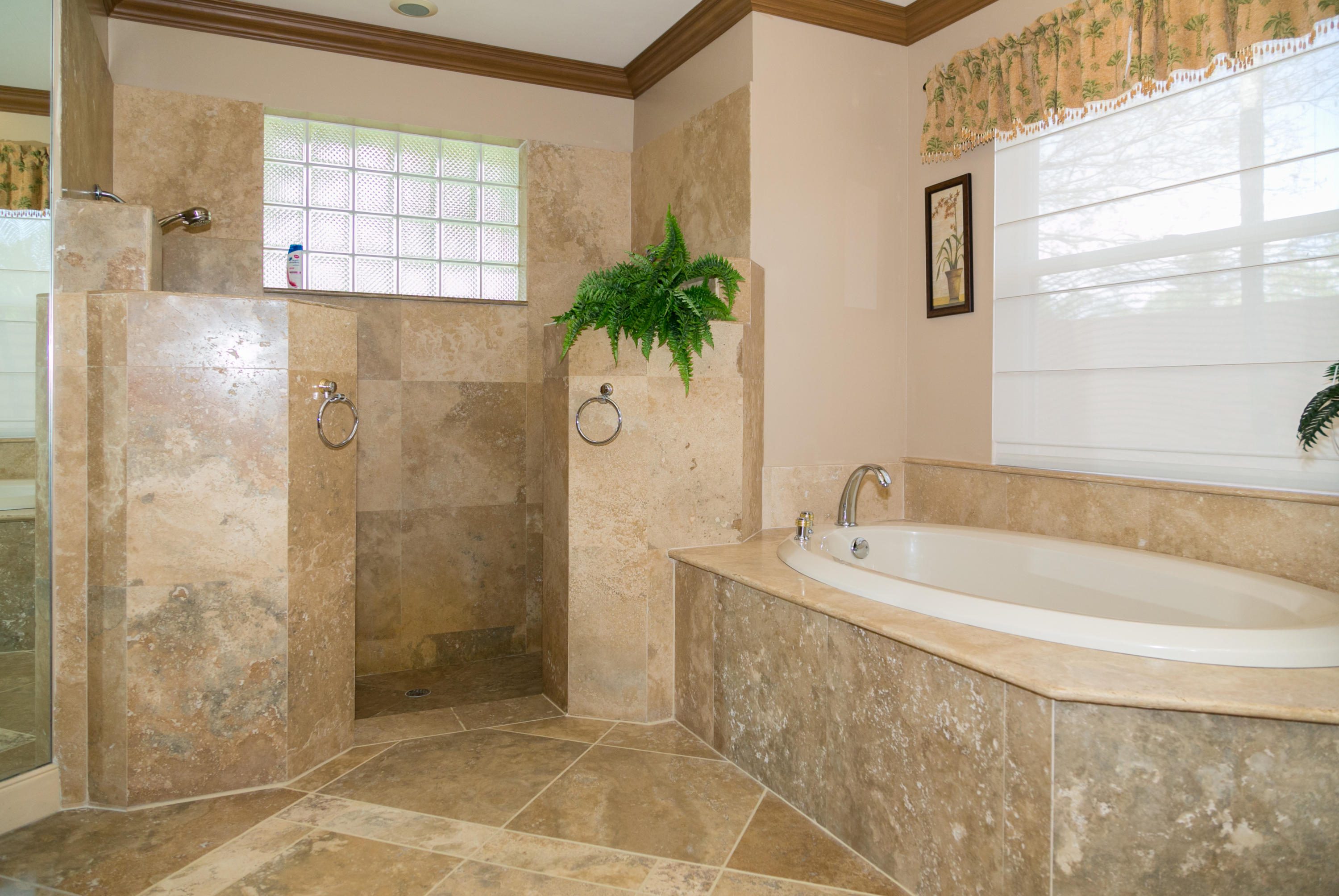 8666 Sawpine Road Delray Beach, FL 33446 - Photo 24 of 49 a bathroom with a bathtub and shower