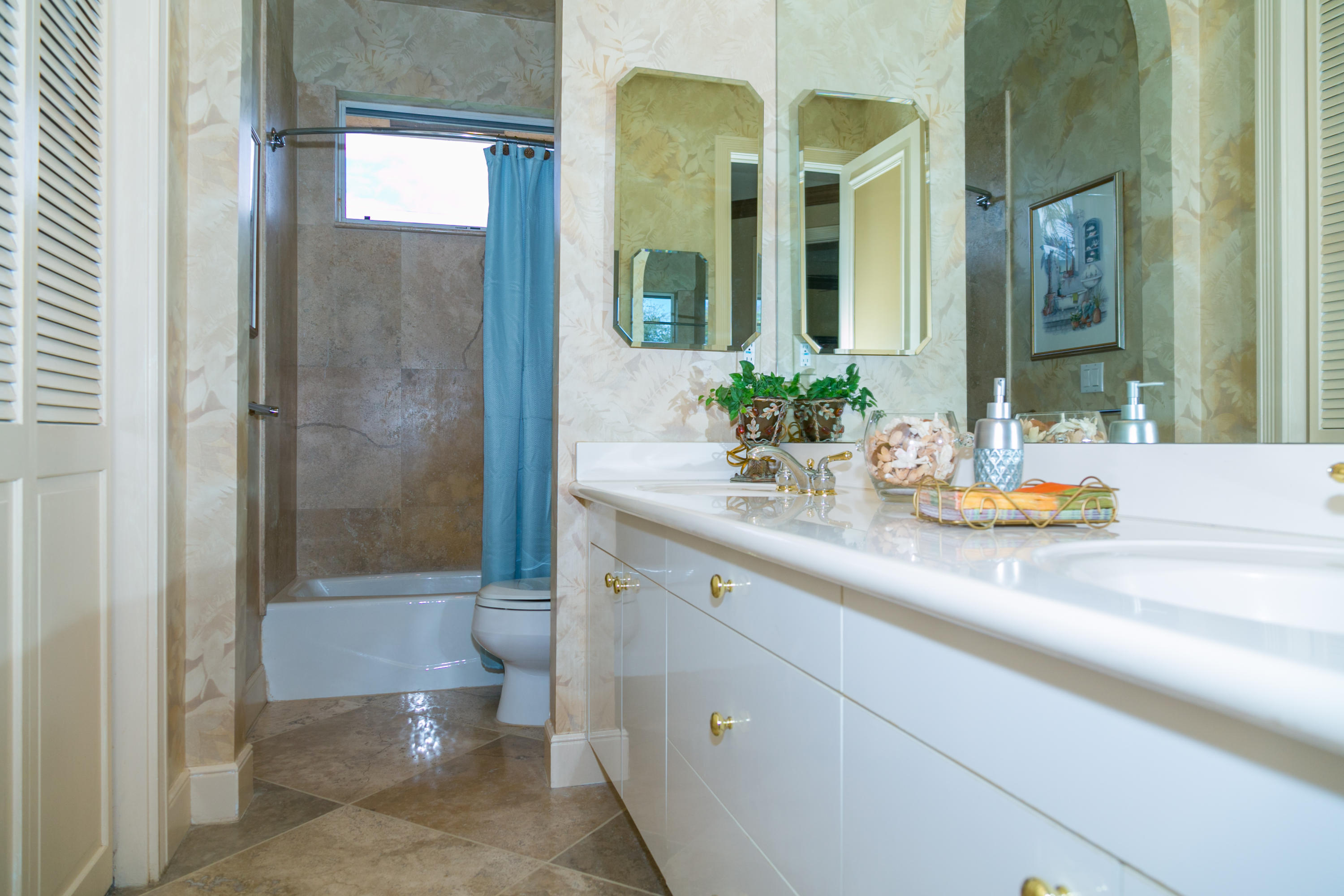 8666 Sawpine Road Delray Beach, FL 33446 - Photo 27 of 49 a bathroom with a sink and a mirror