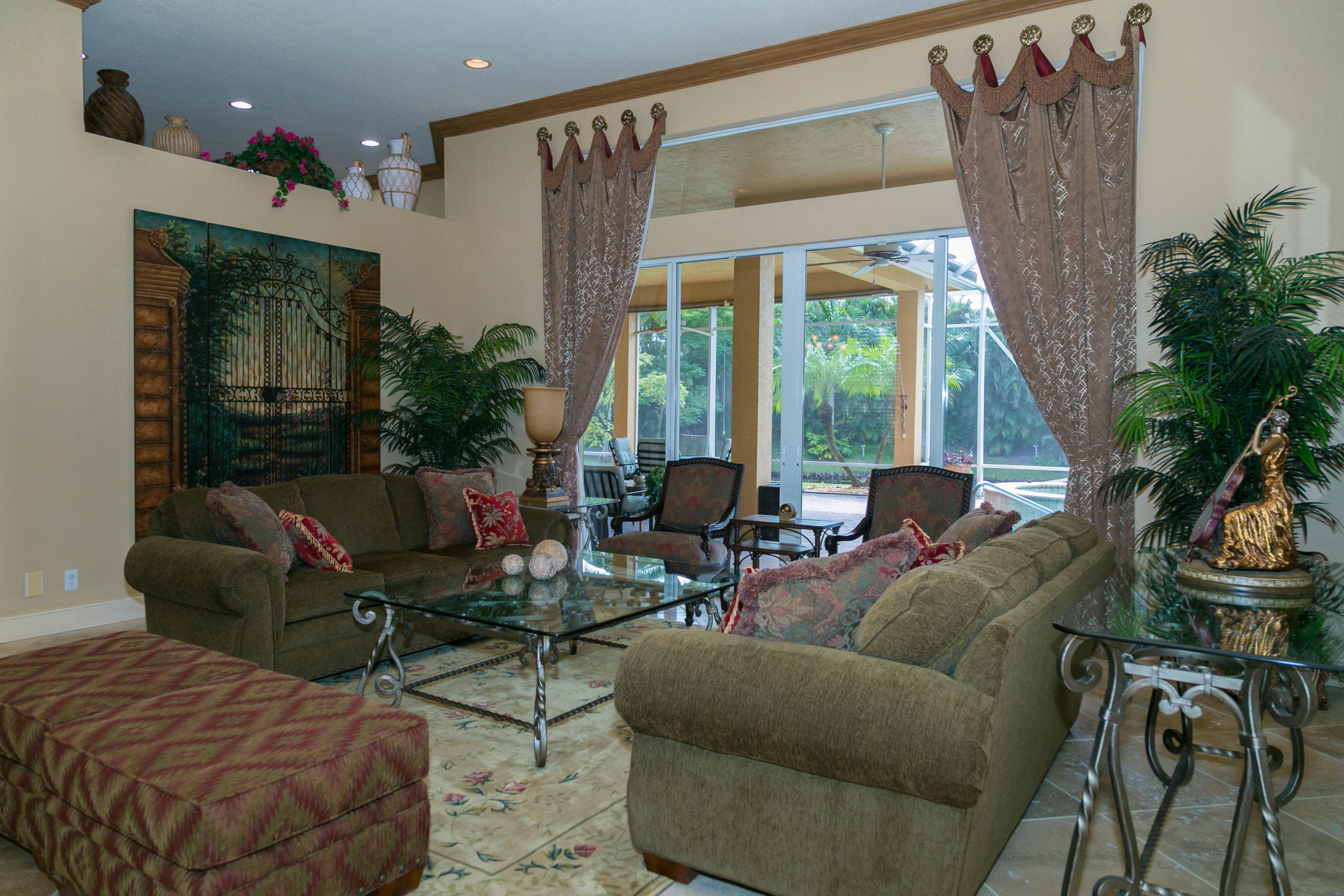 8666 Sawpine Road Delray Beach, FL 33446 - Photo 30 of 49 a living room with furniture and a large window