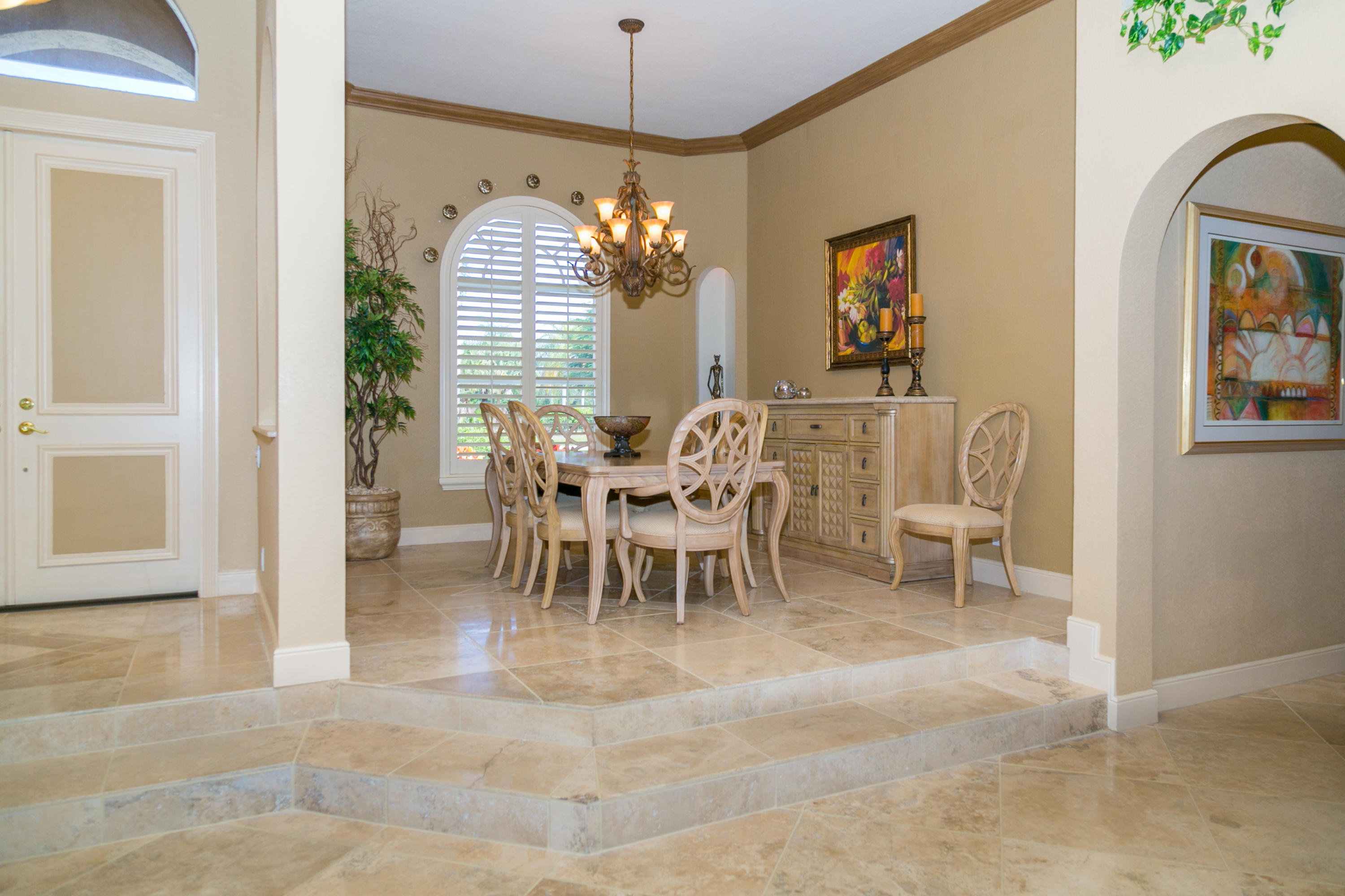 8666 Sawpine Road Delray Beach, FL 33446 - Photo 32 of 49 a view of a dining room with furniture window and wooden floor