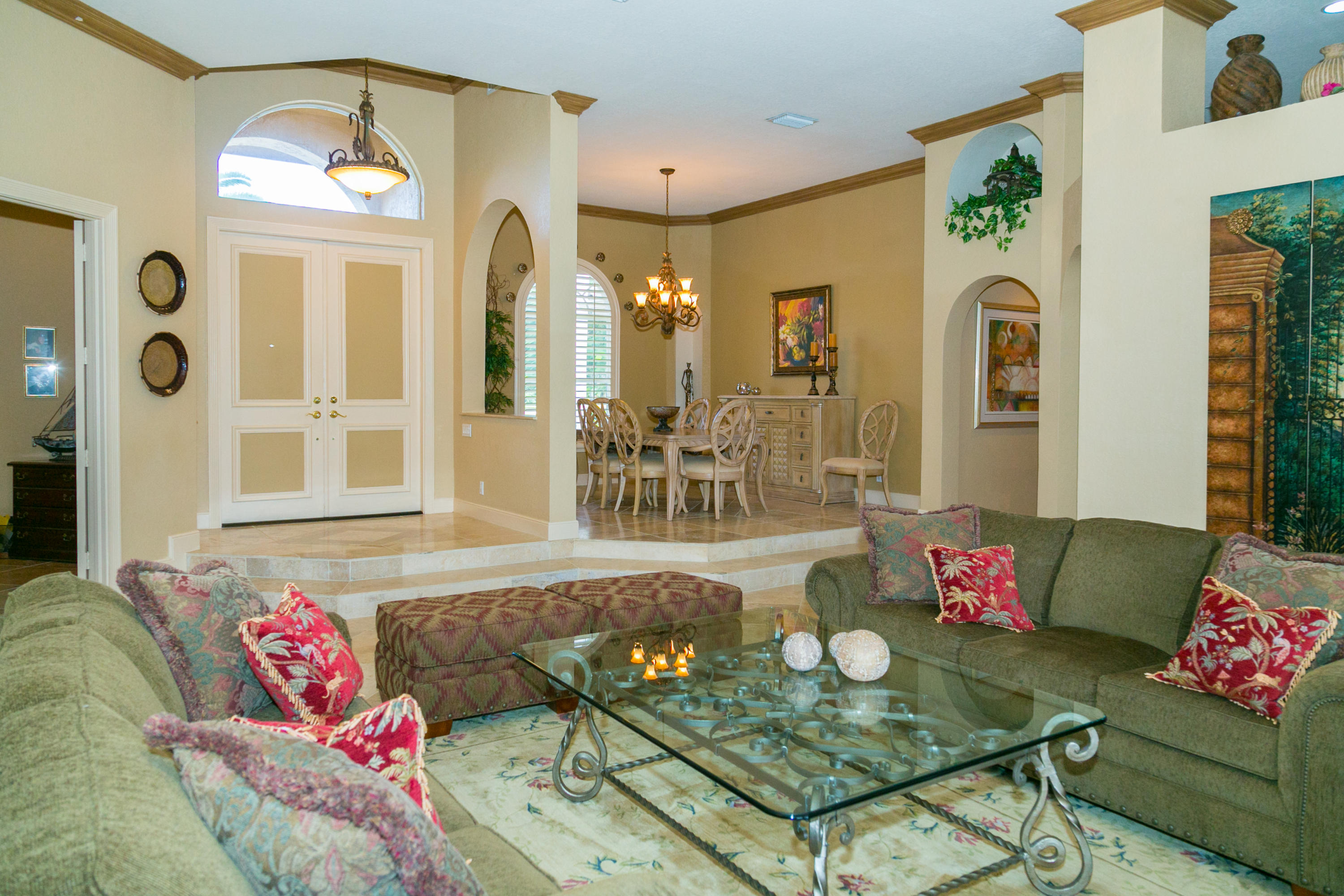 8666 Sawpine Road Delray Beach, FL 33446 - Photo 33 of 49 a living room with furniture and a large window