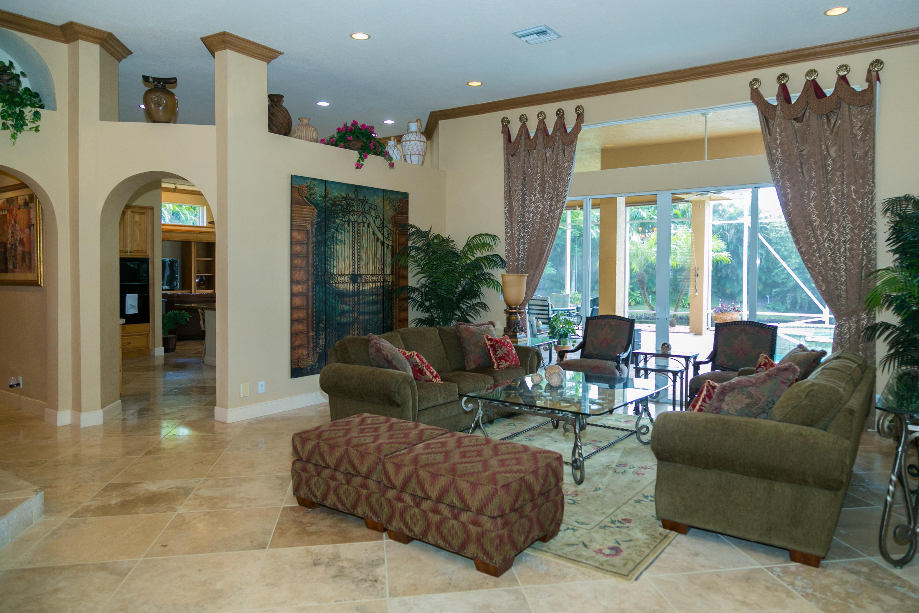8666 Sawpine Road Delray Beach, FL 33446 - Photo 34 of 49 a living room with furniture and a large window