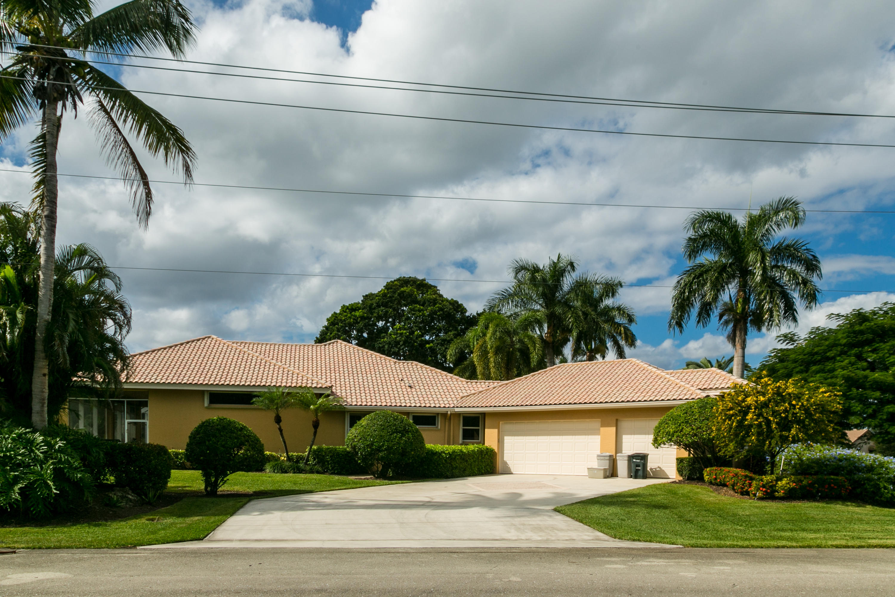 8666 Sawpine Road Delray Beach, FL 33446 - Photo 40 of 49 a front view of a house with garden