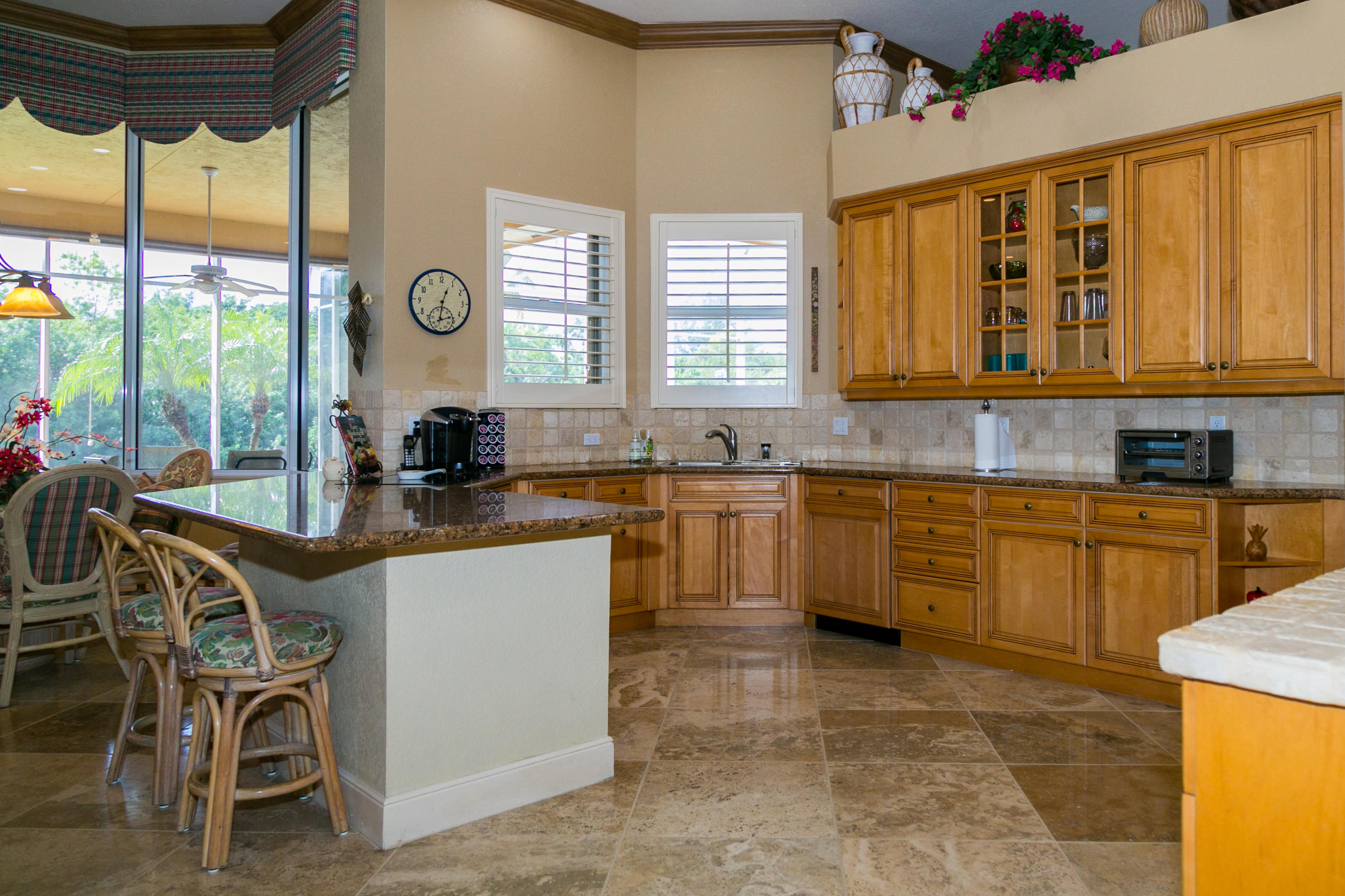 8666 Sawpine Road Delray Beach, FL 33446 - Photo 47 of 49 a kitchen with a sink and white cabinets