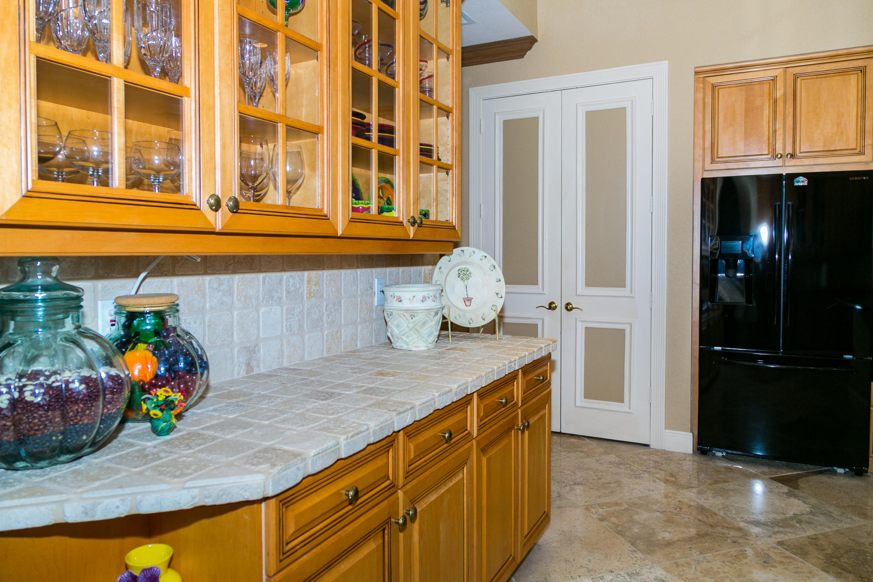 8666 Sawpine Road Delray Beach, FL 33446 - Photo 48 of 49 a kitchen with a sink and cabinets