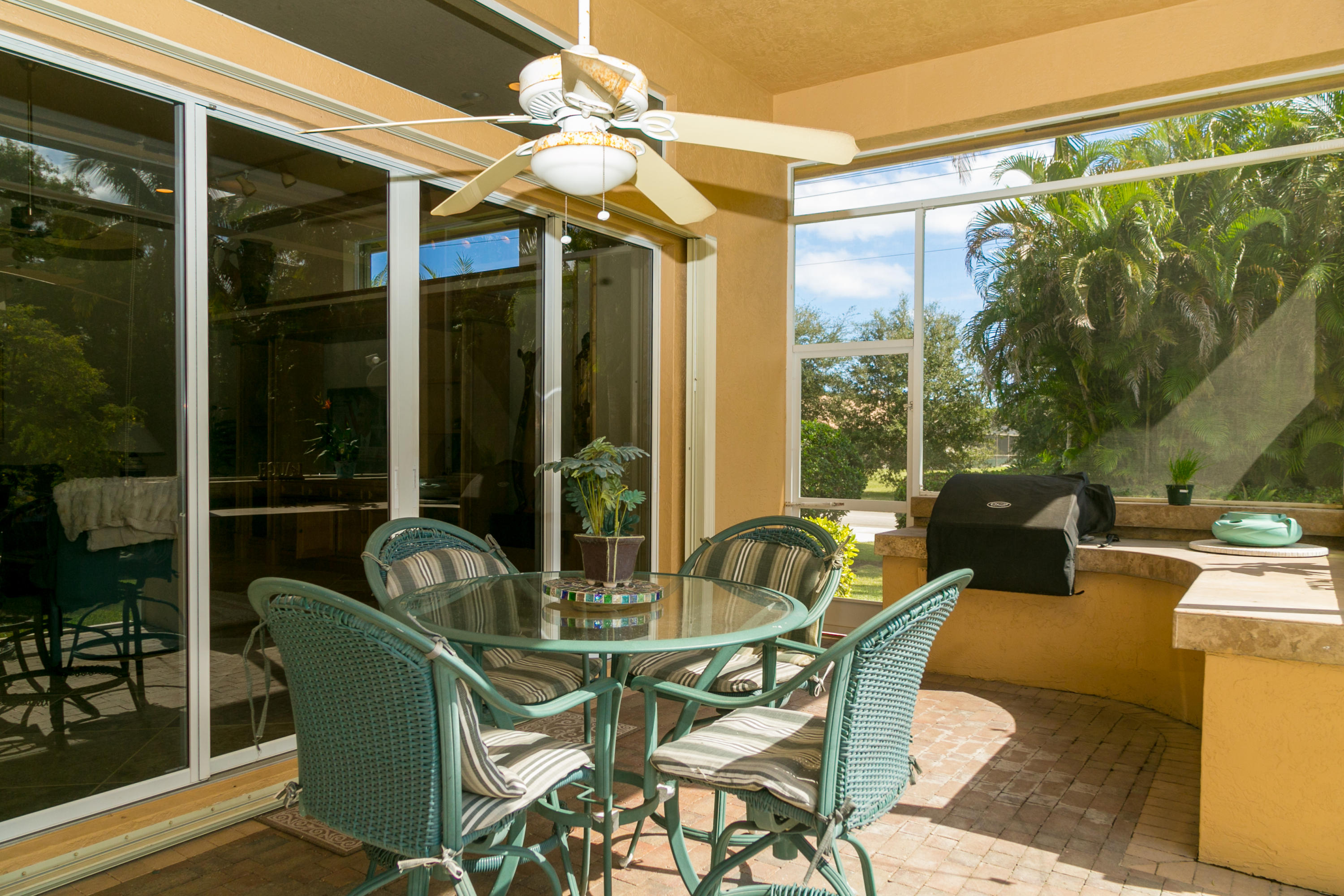 8666 Sawpine Road Delray Beach, FL 33446 - Photo 5 of 49 a view of a patio with dining table and chairs