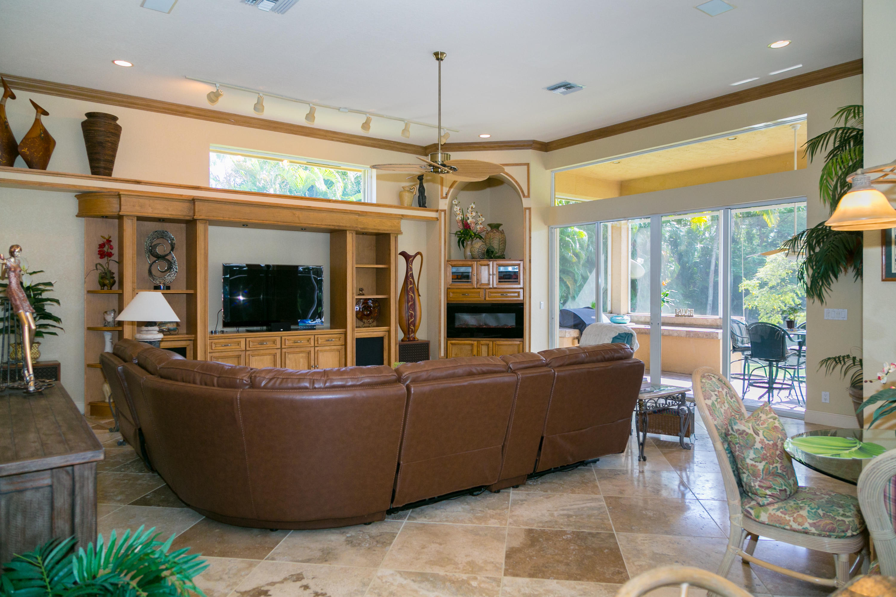 8666 Sawpine Road Delray Beach, FL 33446 - Photo 8 of 49 a living room with furniture and a flat screen tv