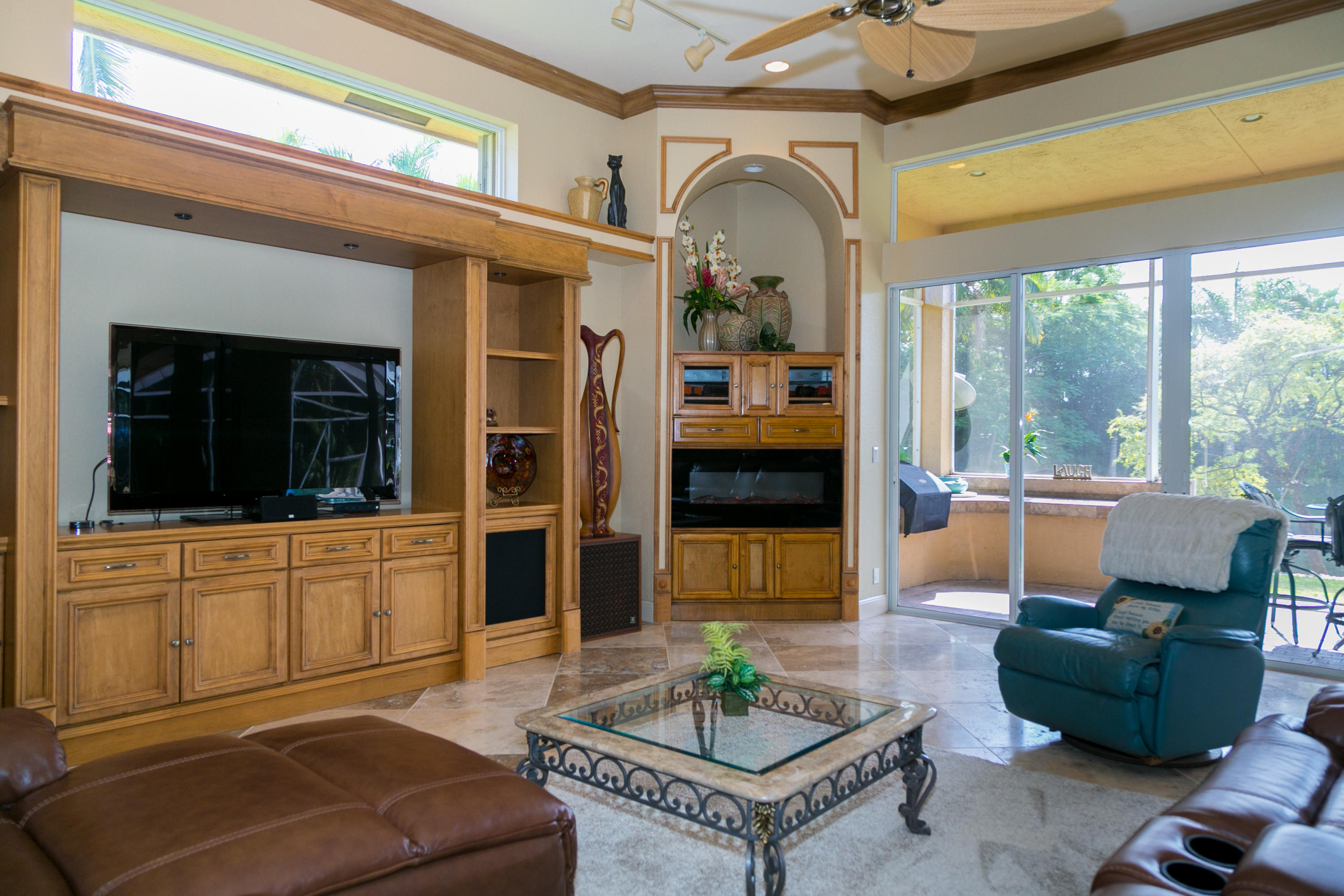 8666 Sawpine Road Delray Beach, FL 33446 - Photo 9 of 49 a living room with furniture and a flat screen tv
