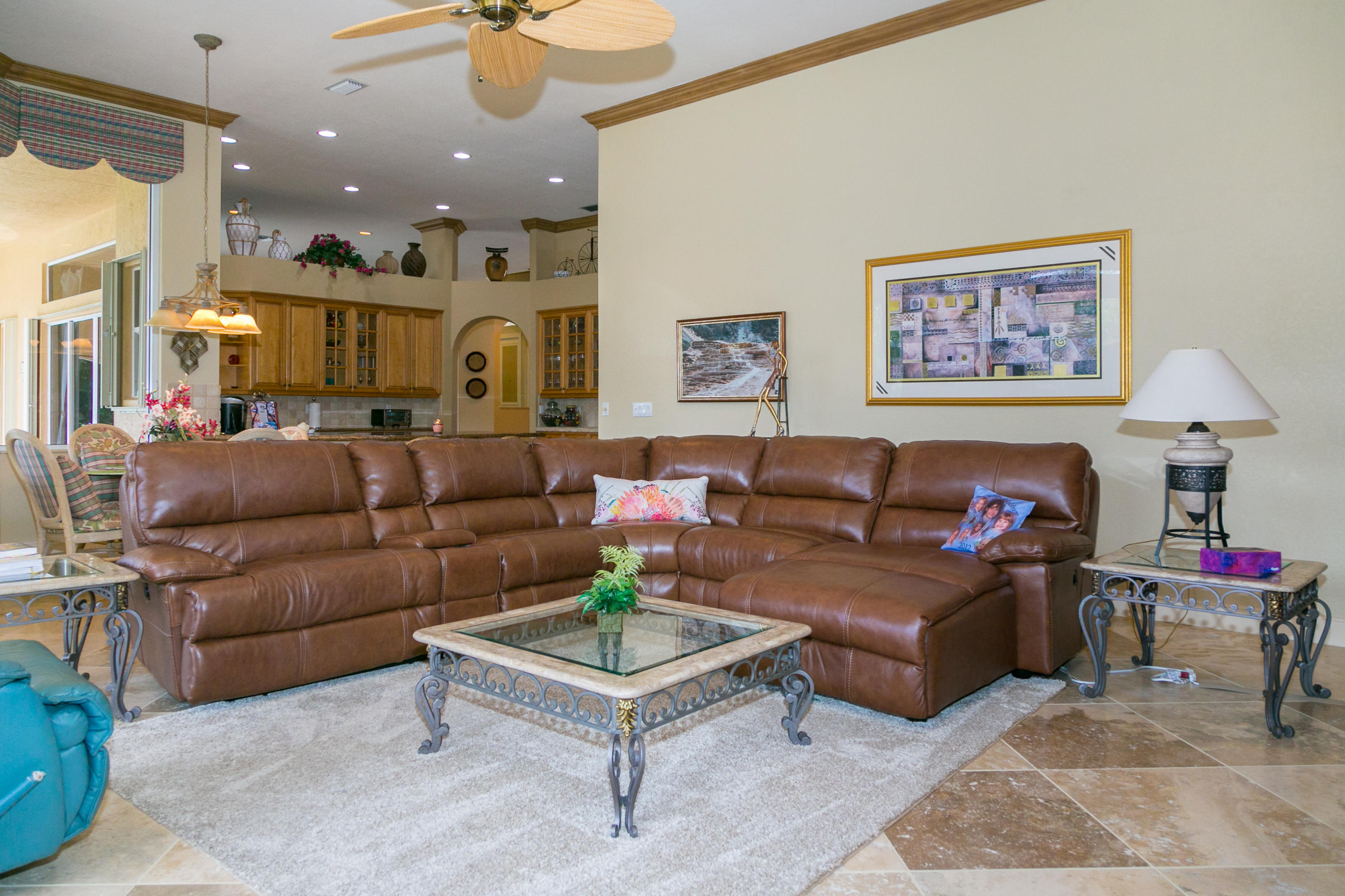 8666 Sawpine Road Delray Beach, FL 33446 - Photo 10 of 49 a living room with furniture and a chandelier