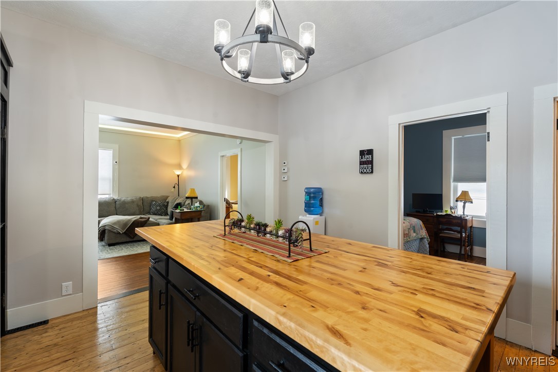 6707 East Lake Road Castile, NY 14427 - Photo 17 of 38 Kitchen island with view of bedroom doors and livi